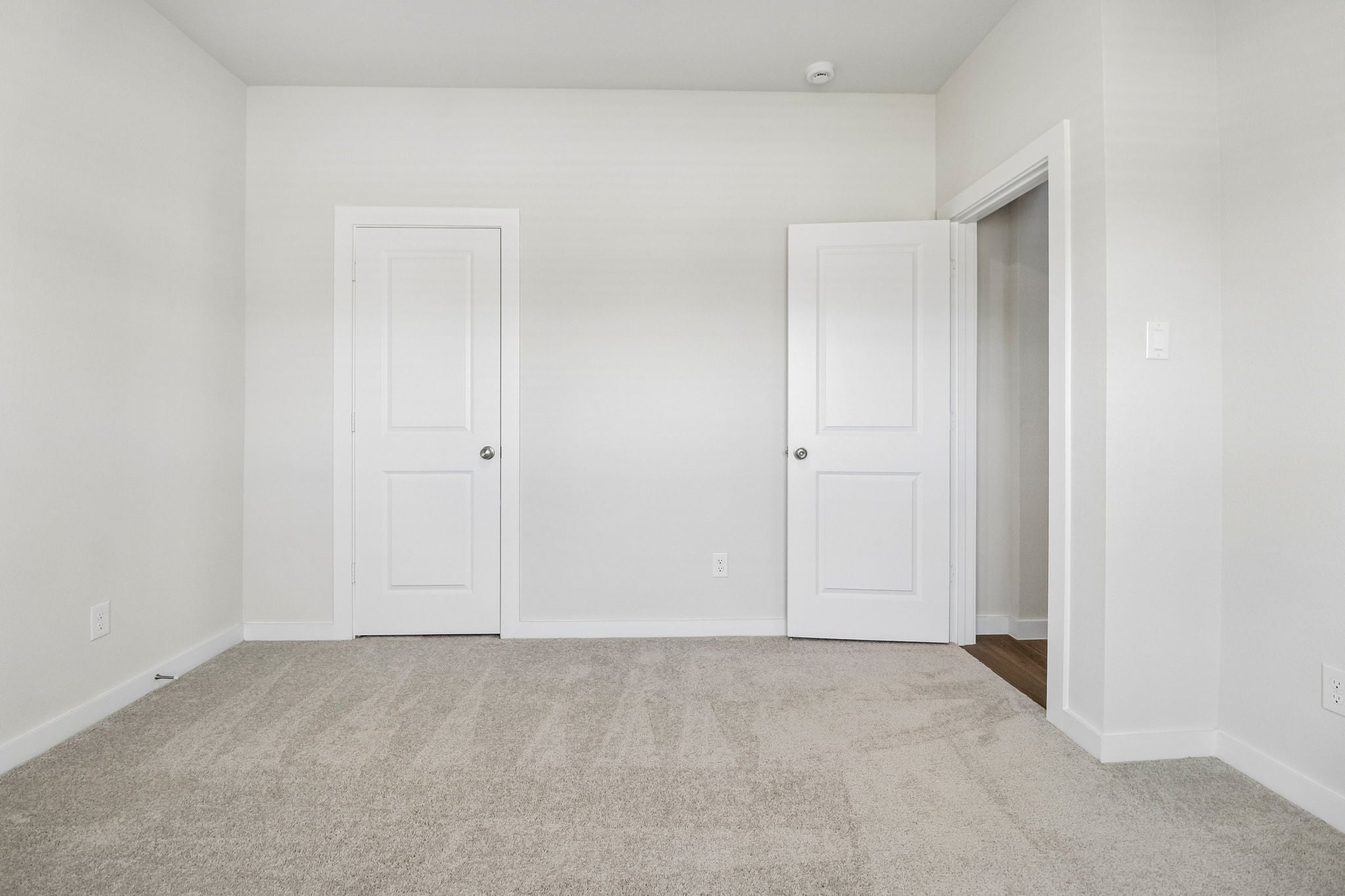A room with white doors.