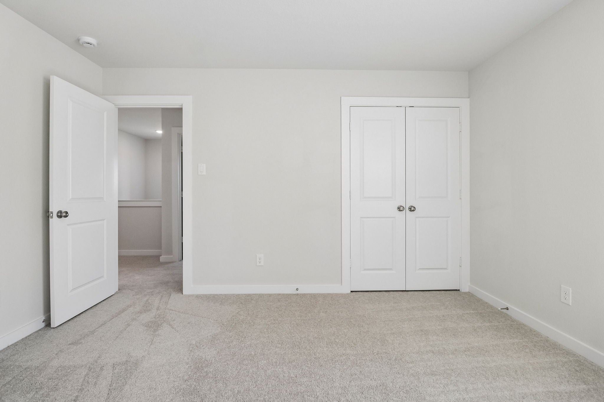 A room with white doors.