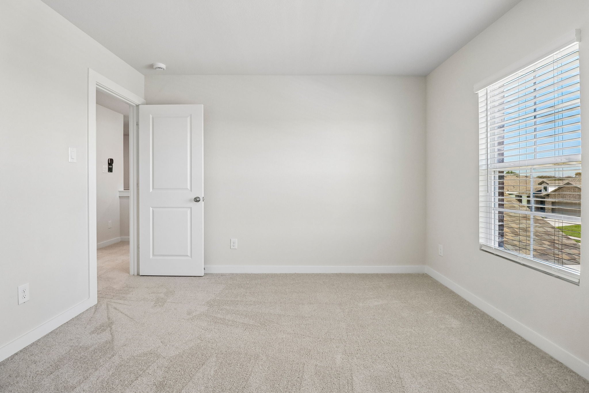 A room with a door and a window.