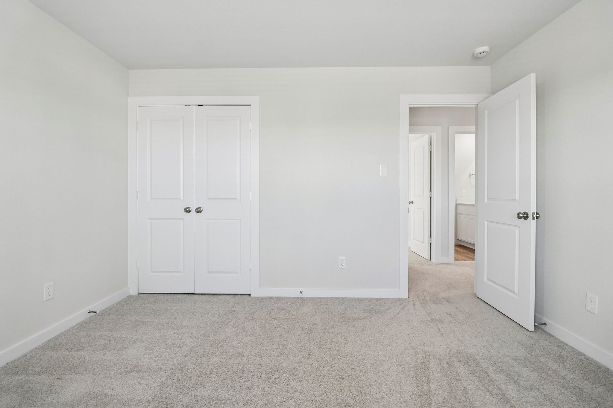 A room with white doors.