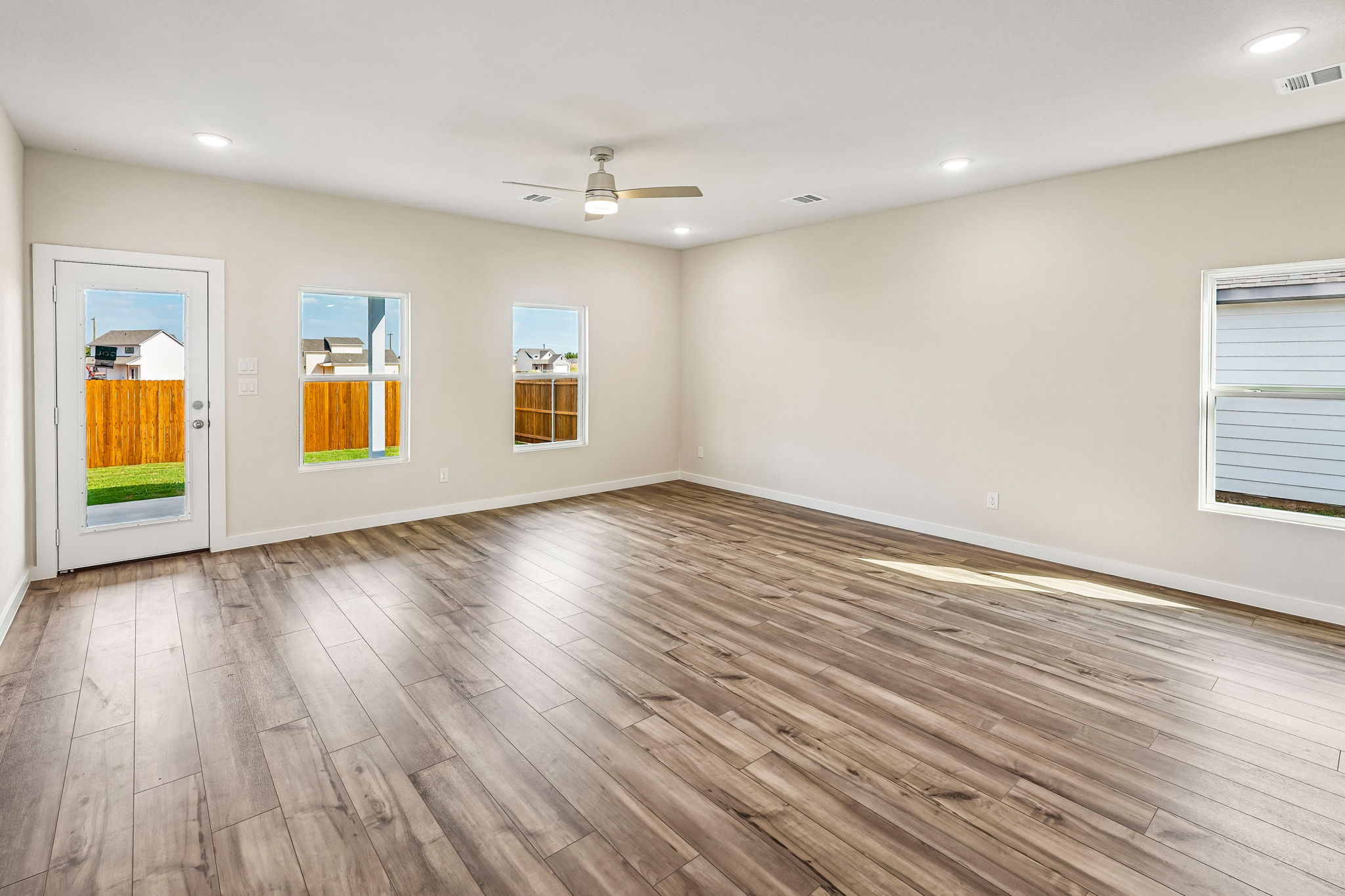 A room with a wood floor and a wood floor with a wood floor.