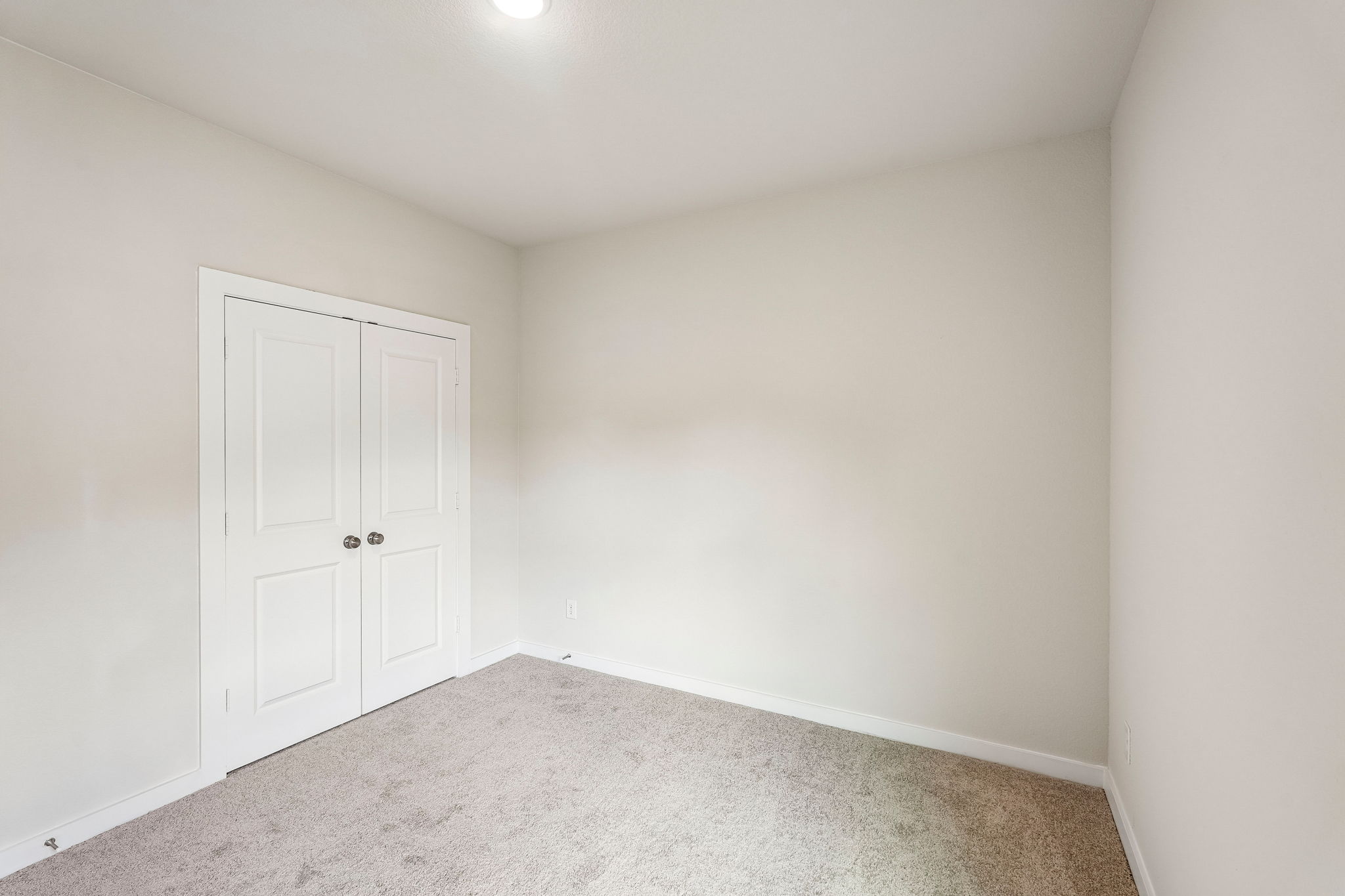 A room with white doors.