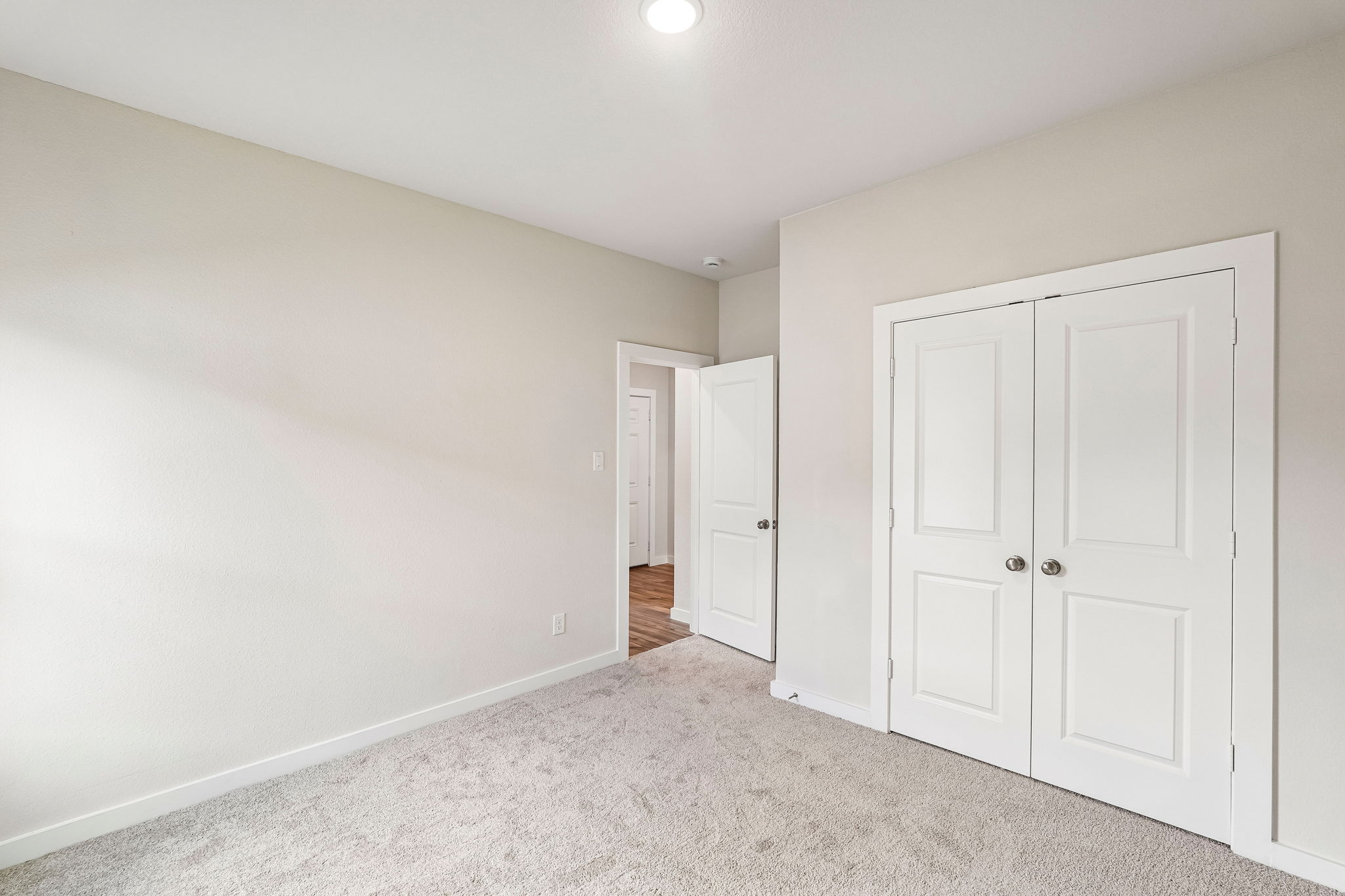 A room with white doors.