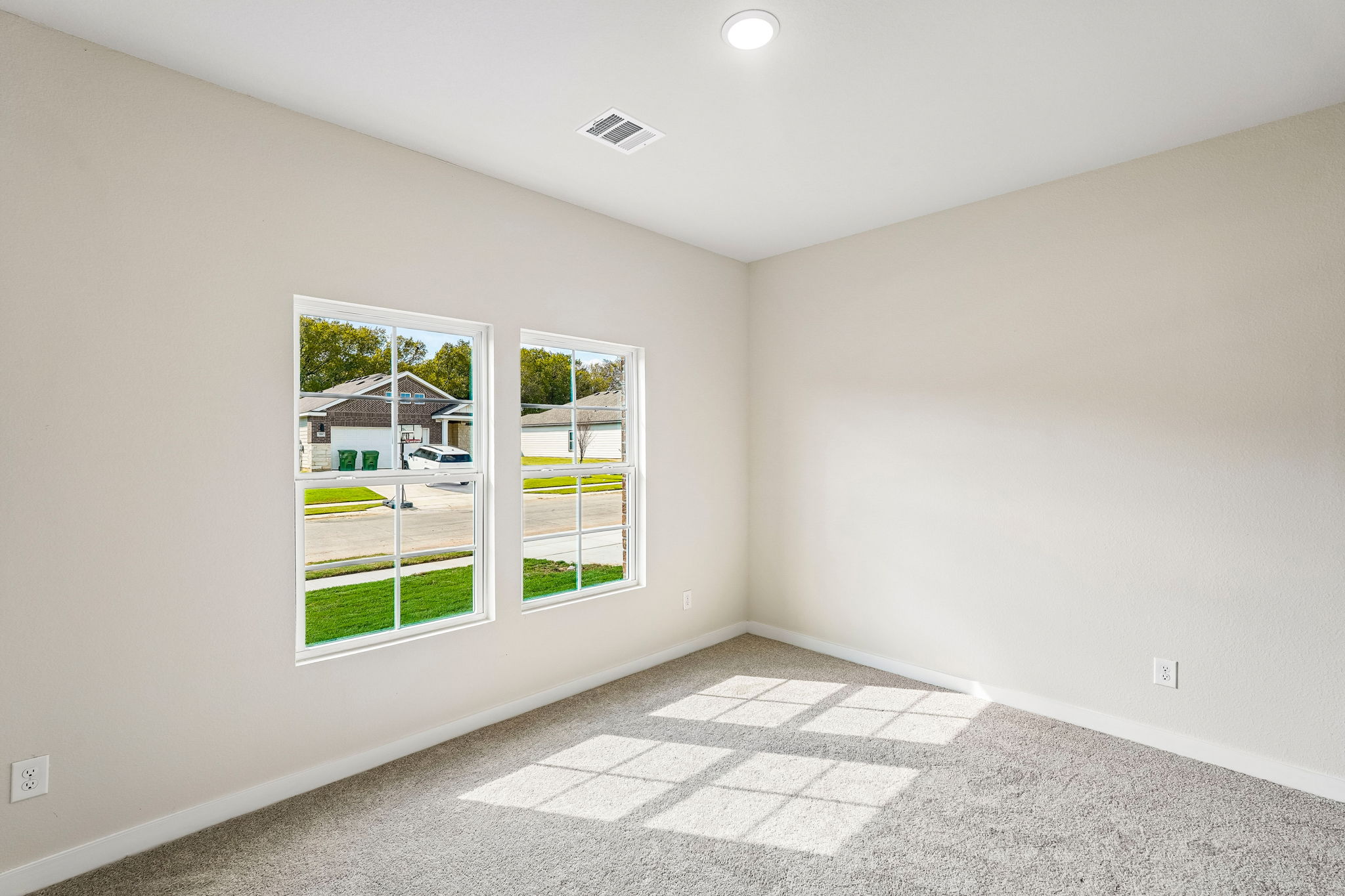 A room with a window and a tile floor.