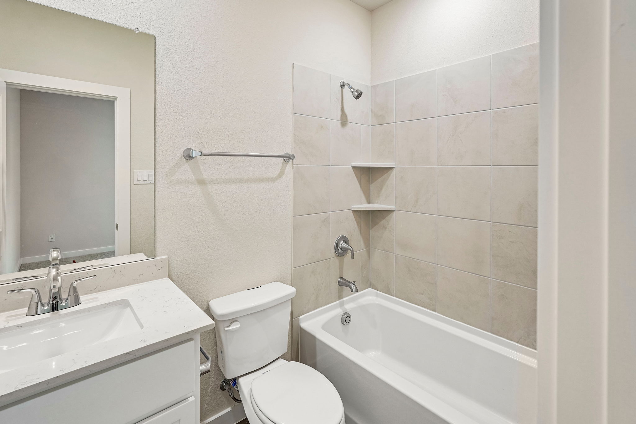 A bathroom with a toilet and sink.