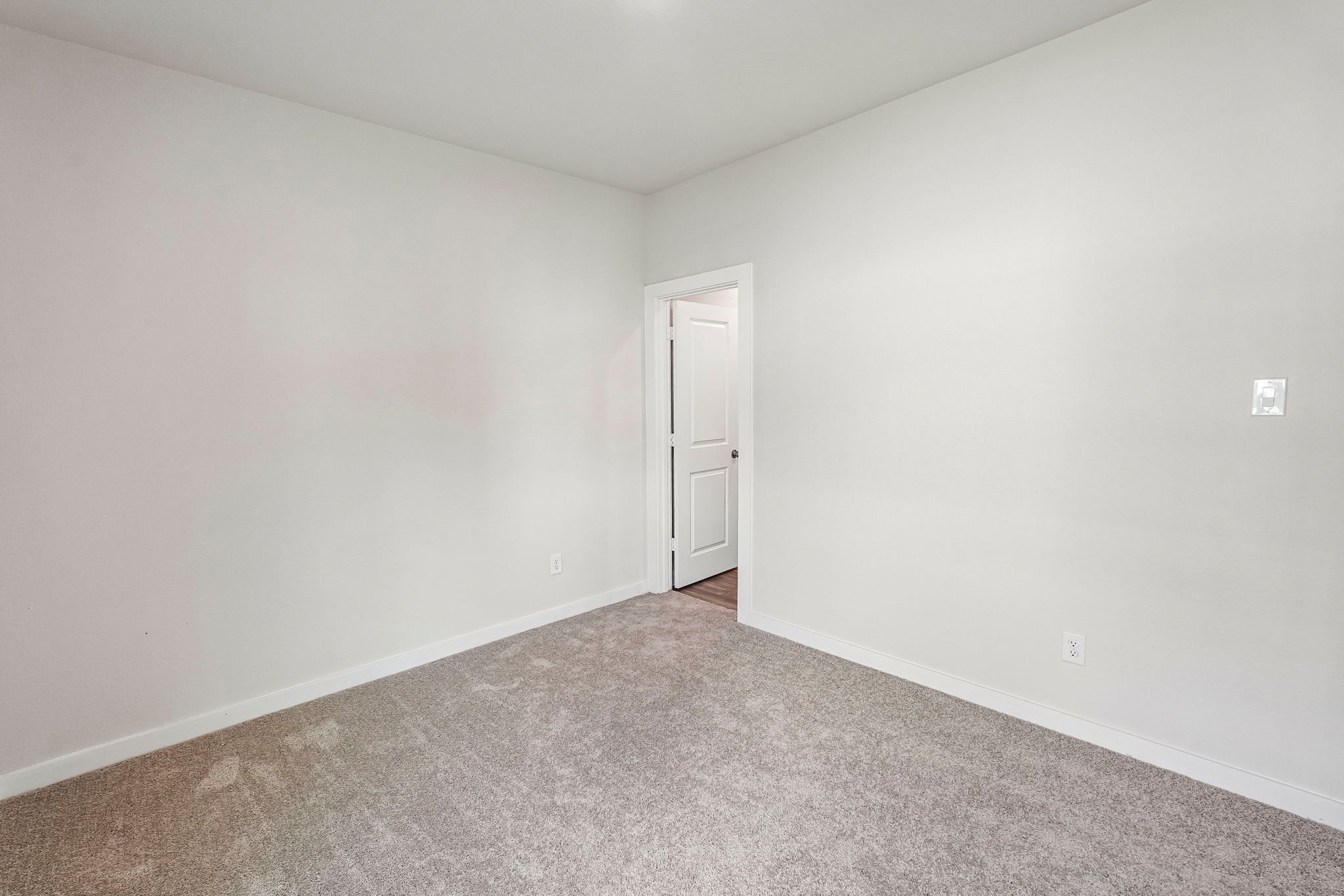 A hallway with a door.