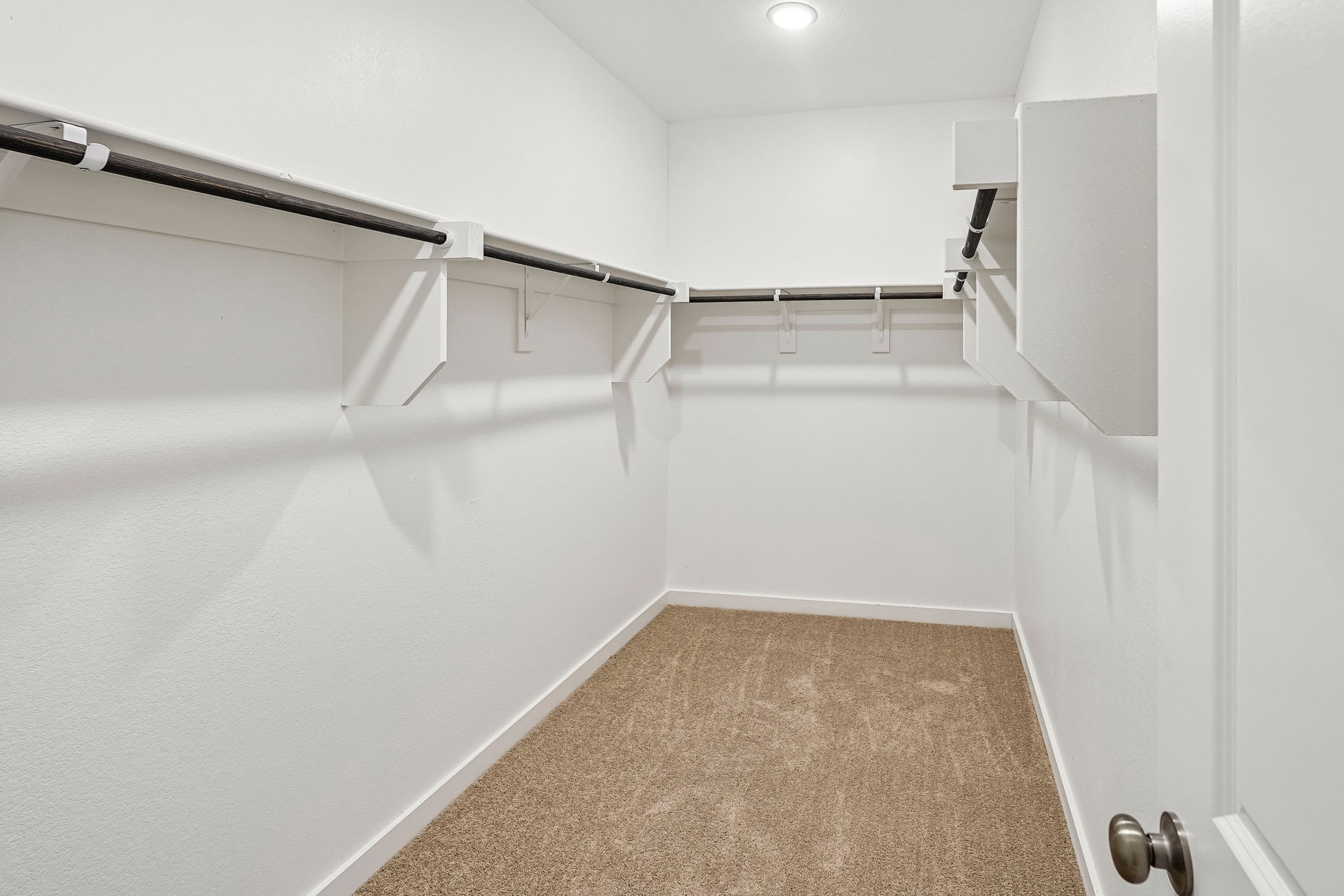 A hallway with white walls.