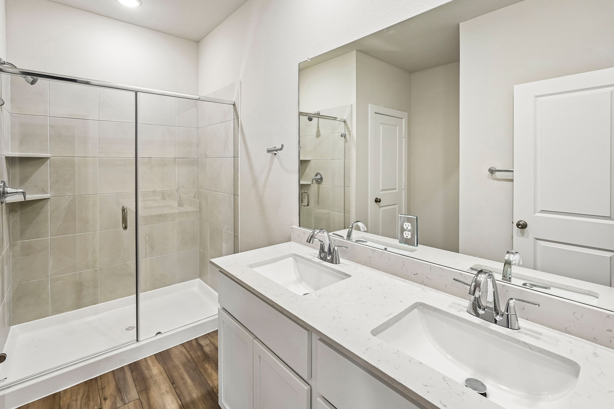 A bathroom with a glass shower.