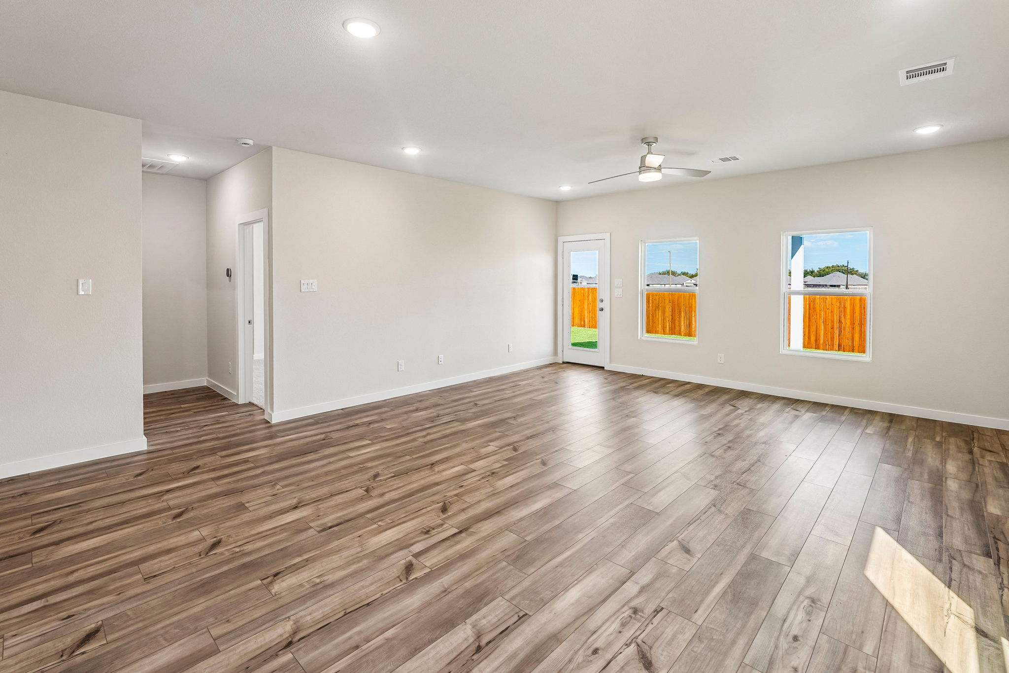 A room with wood floors.