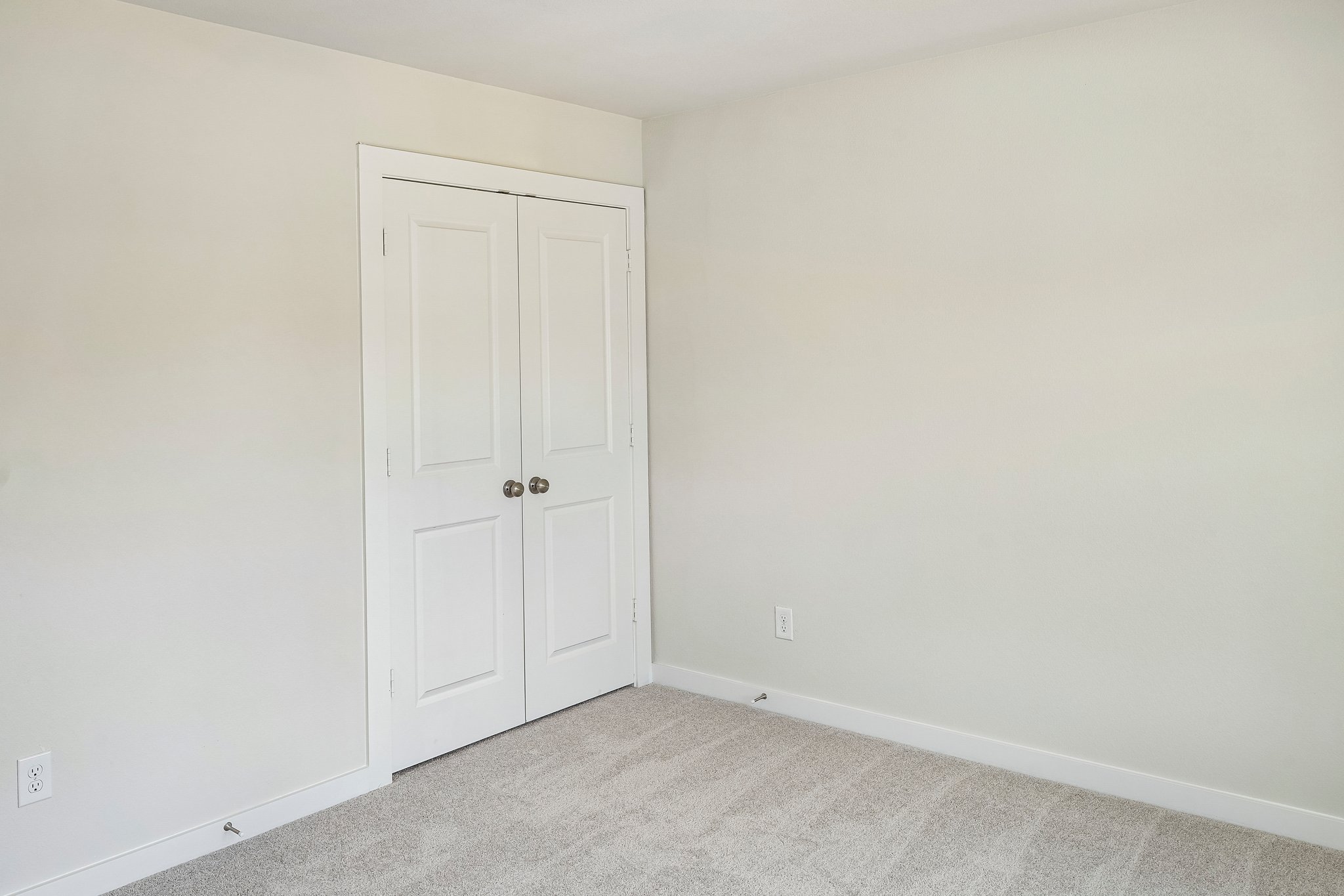 A room with white doors.