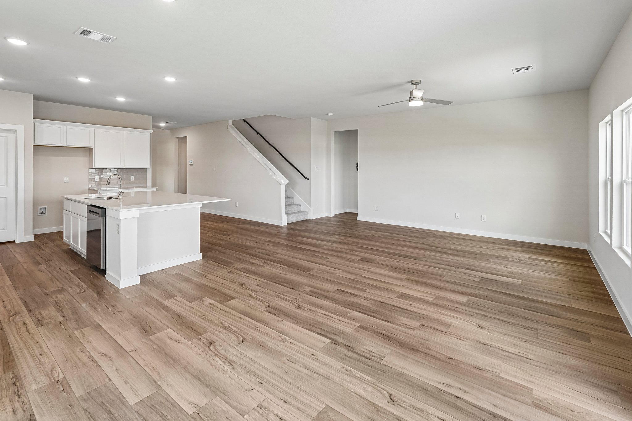 A large kitchen with white cabinets.