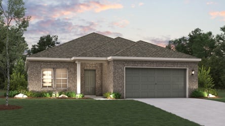 A house with a garage and a lawn in front of it.