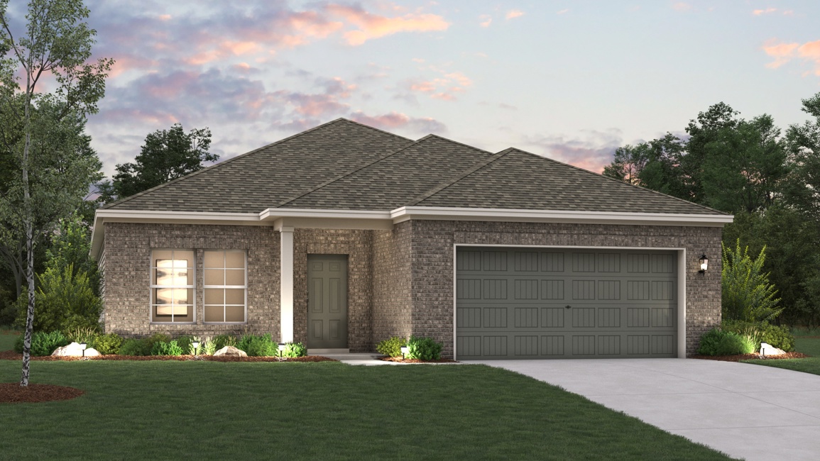 A house with a garage and a lawn in front of it.