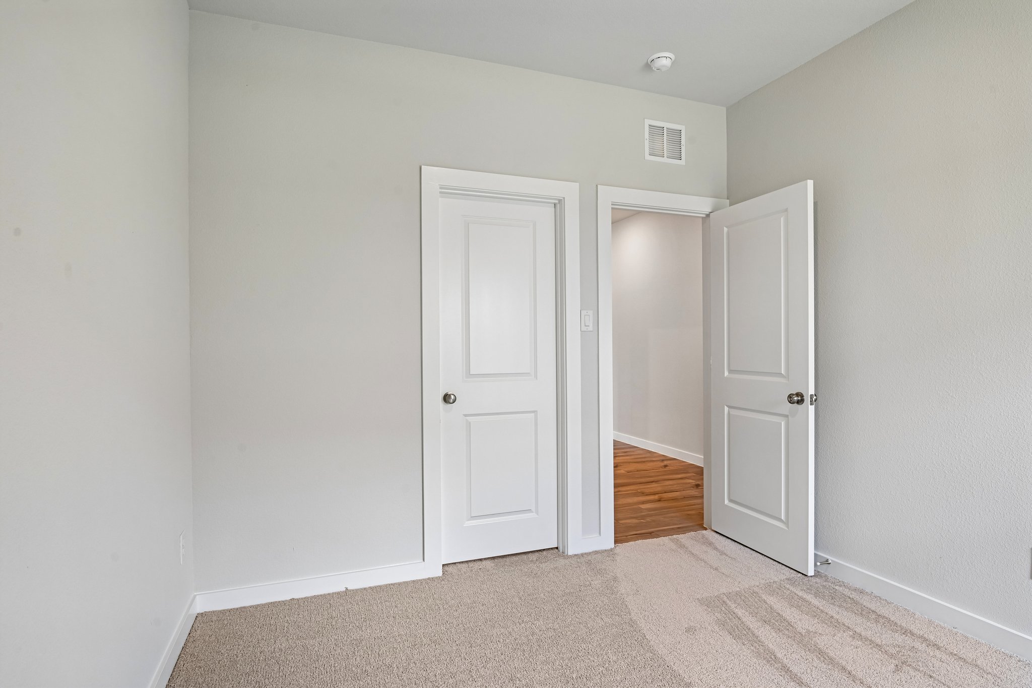 A room with white doors.