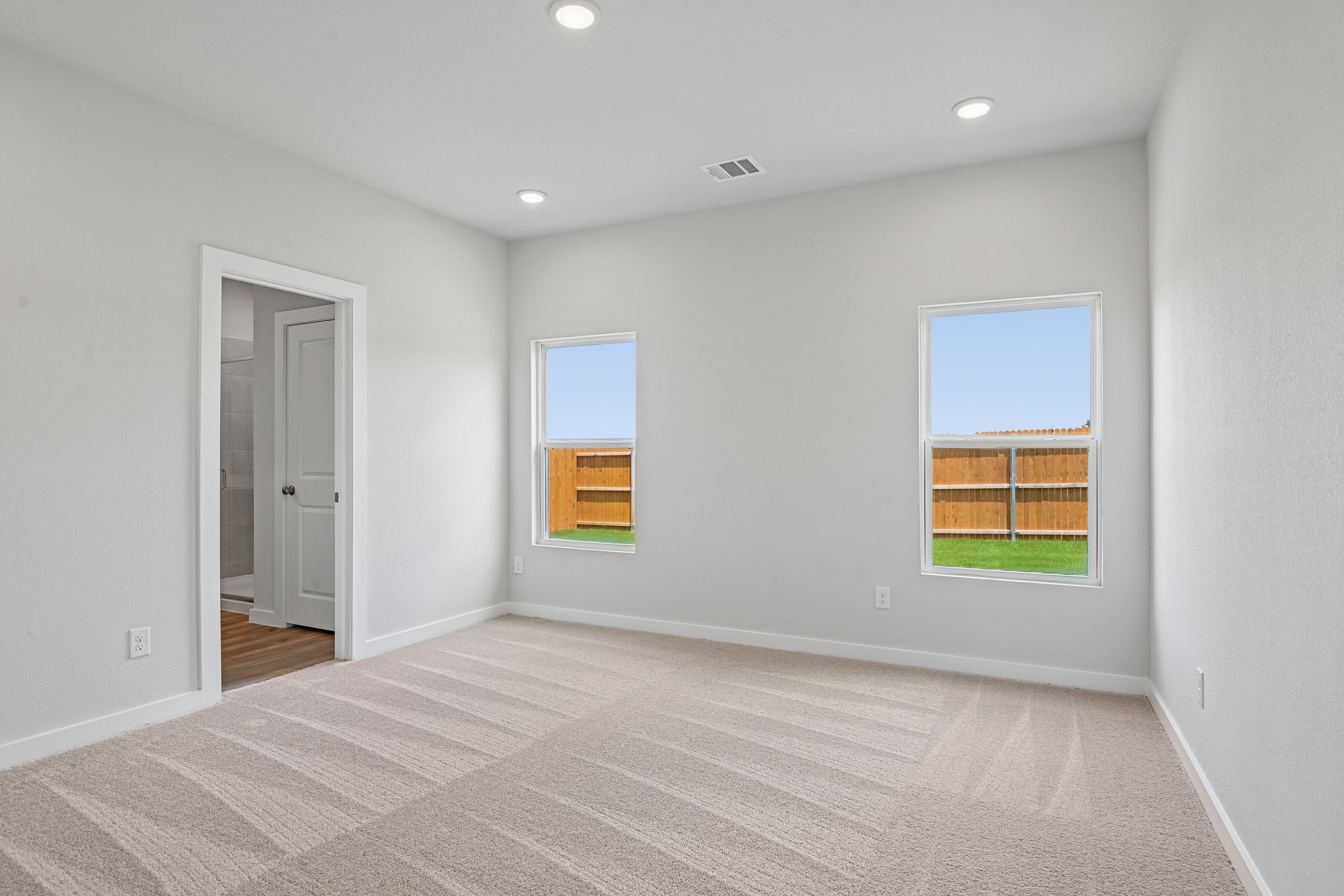 A room with a window and a door.