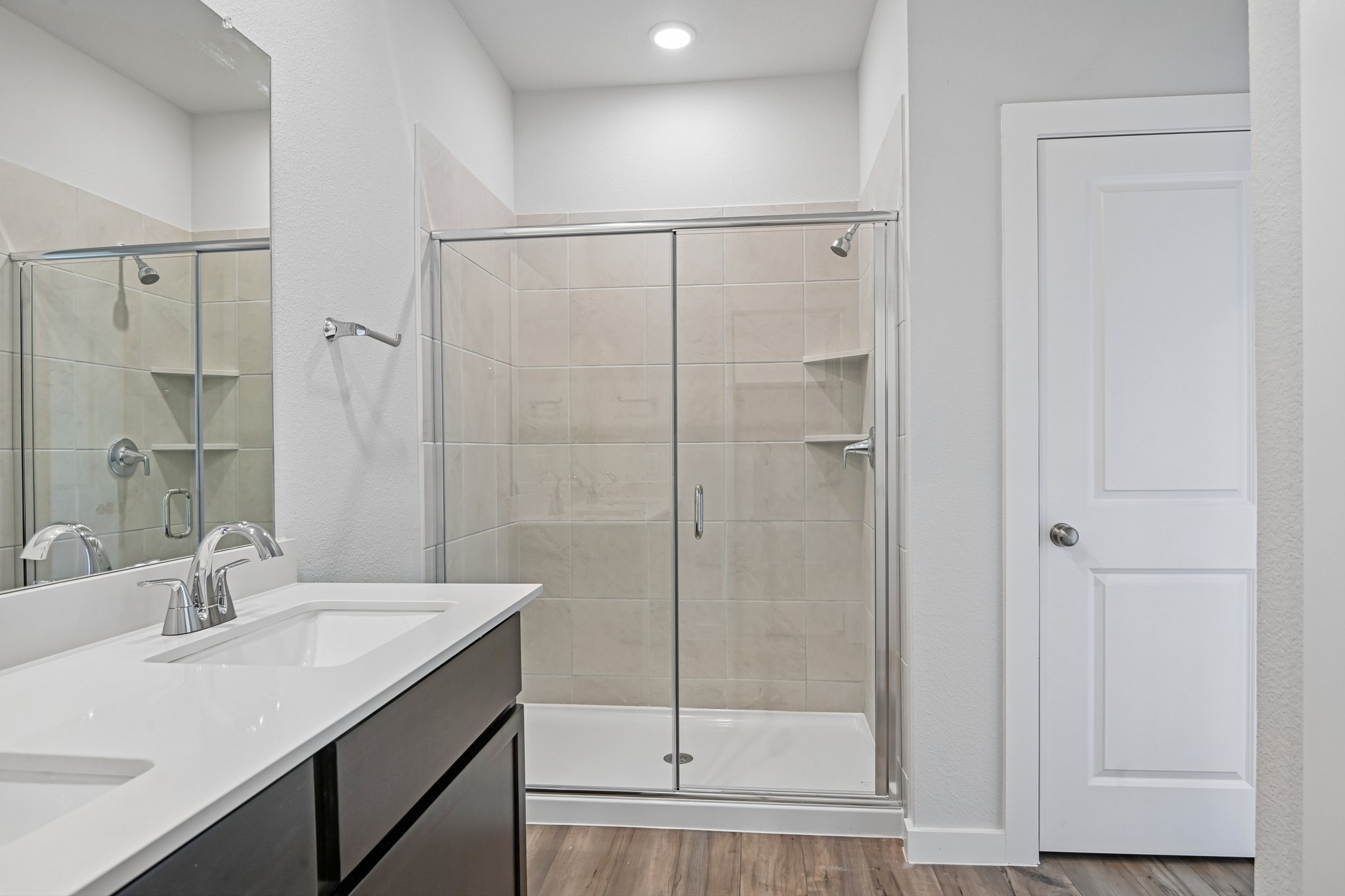 A bathroom with a glass shower.