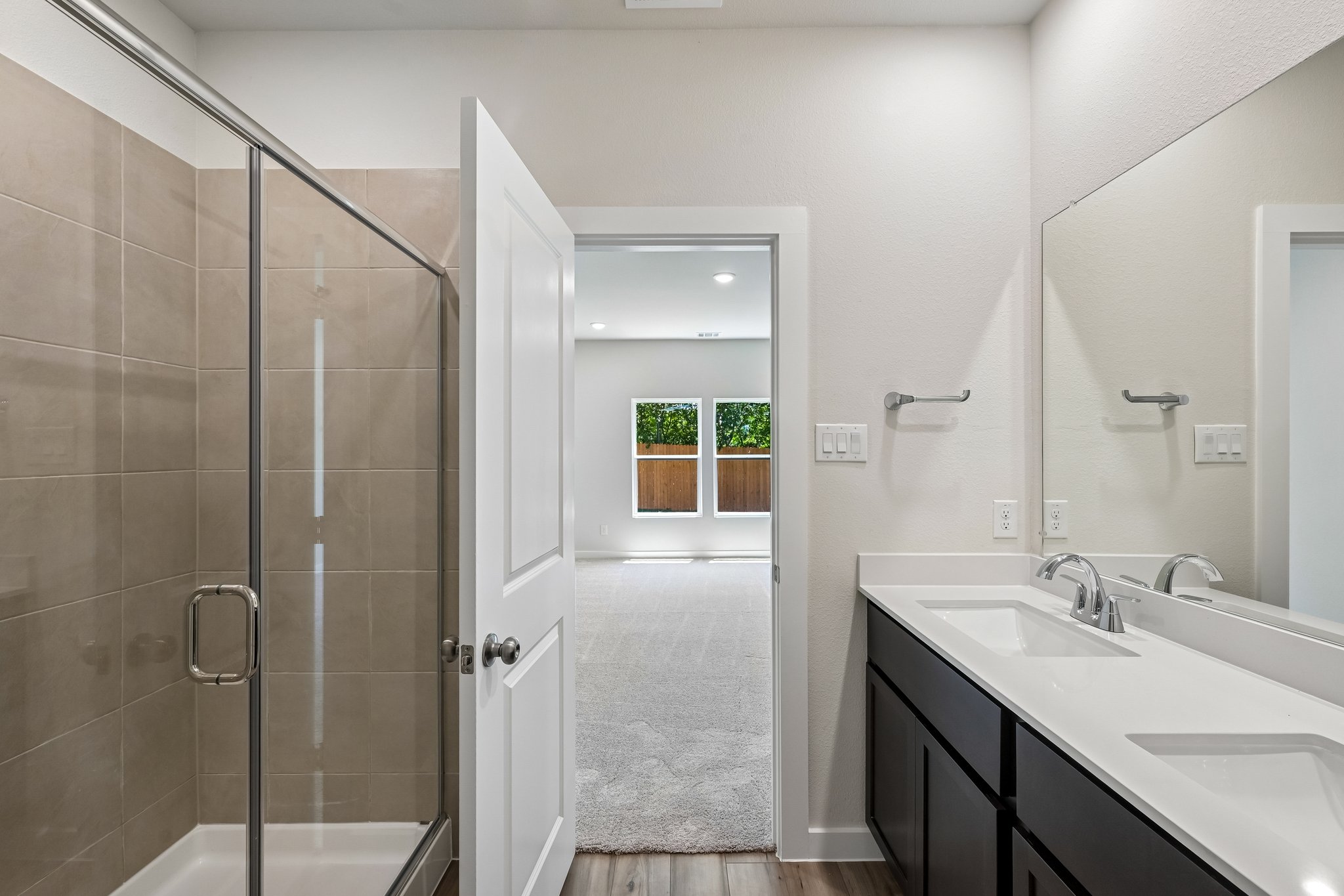 A bathroom with a glass shower.