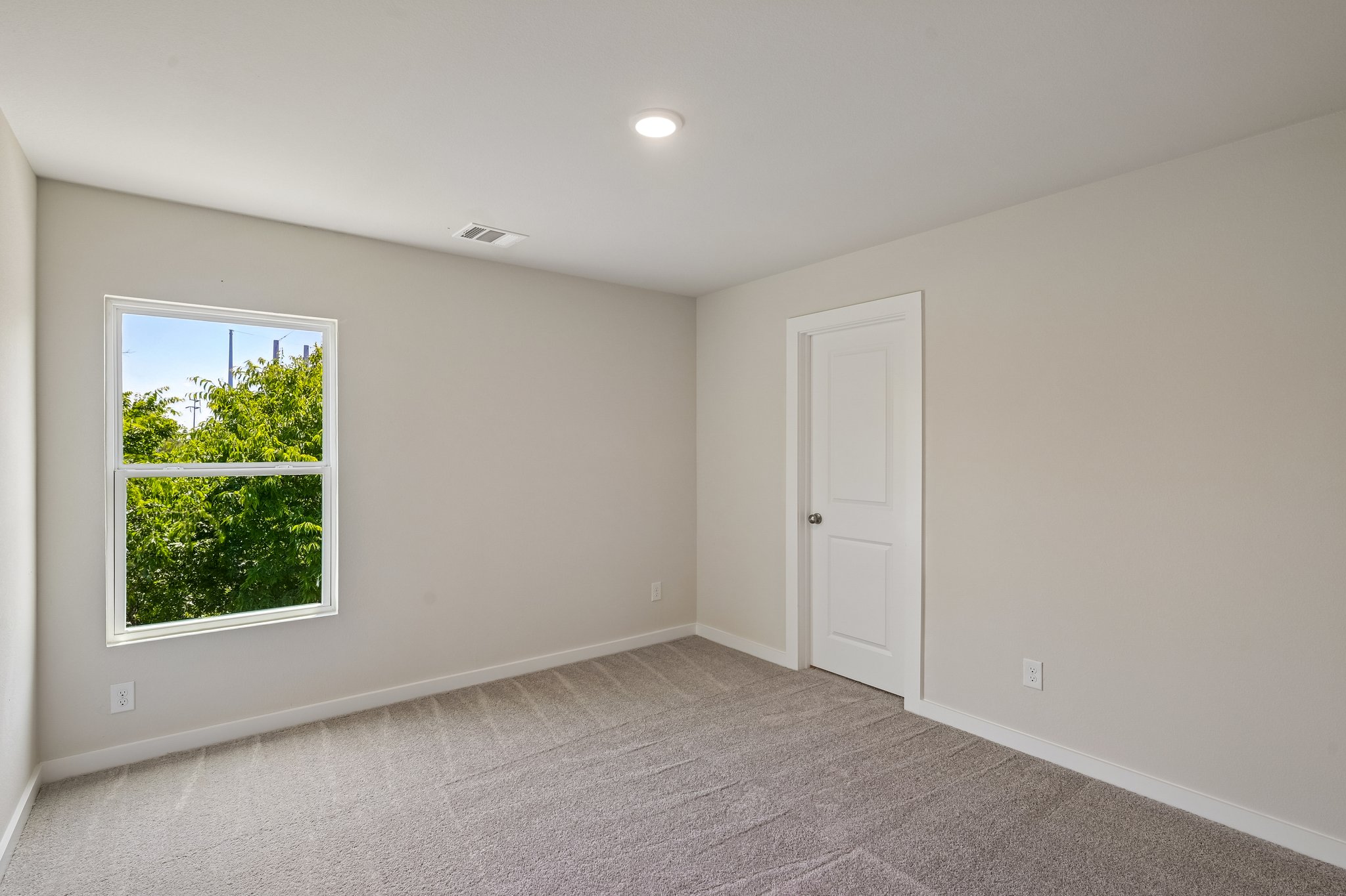 A room with a door and a window.