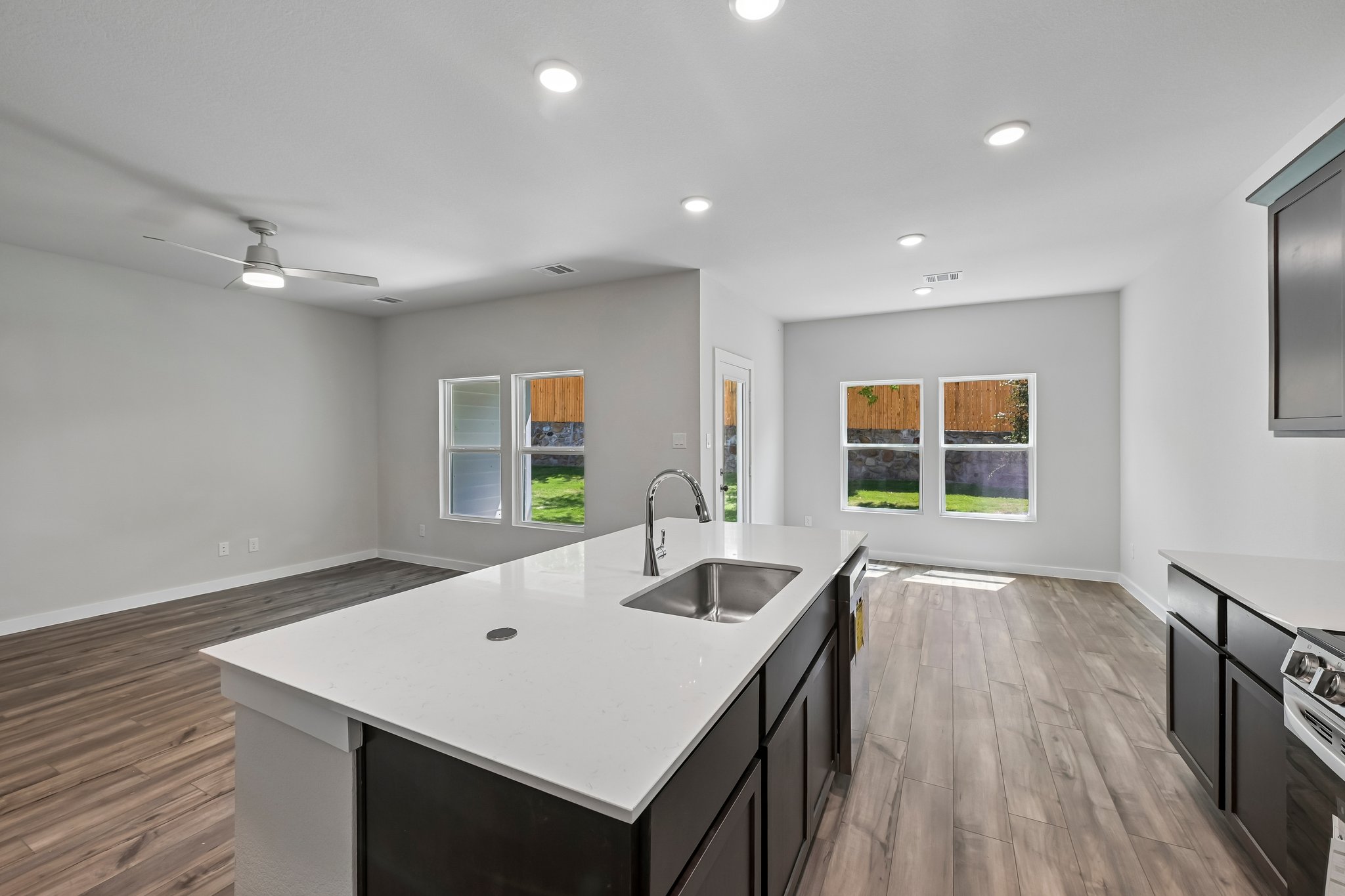 A kitchen with a wood floor.