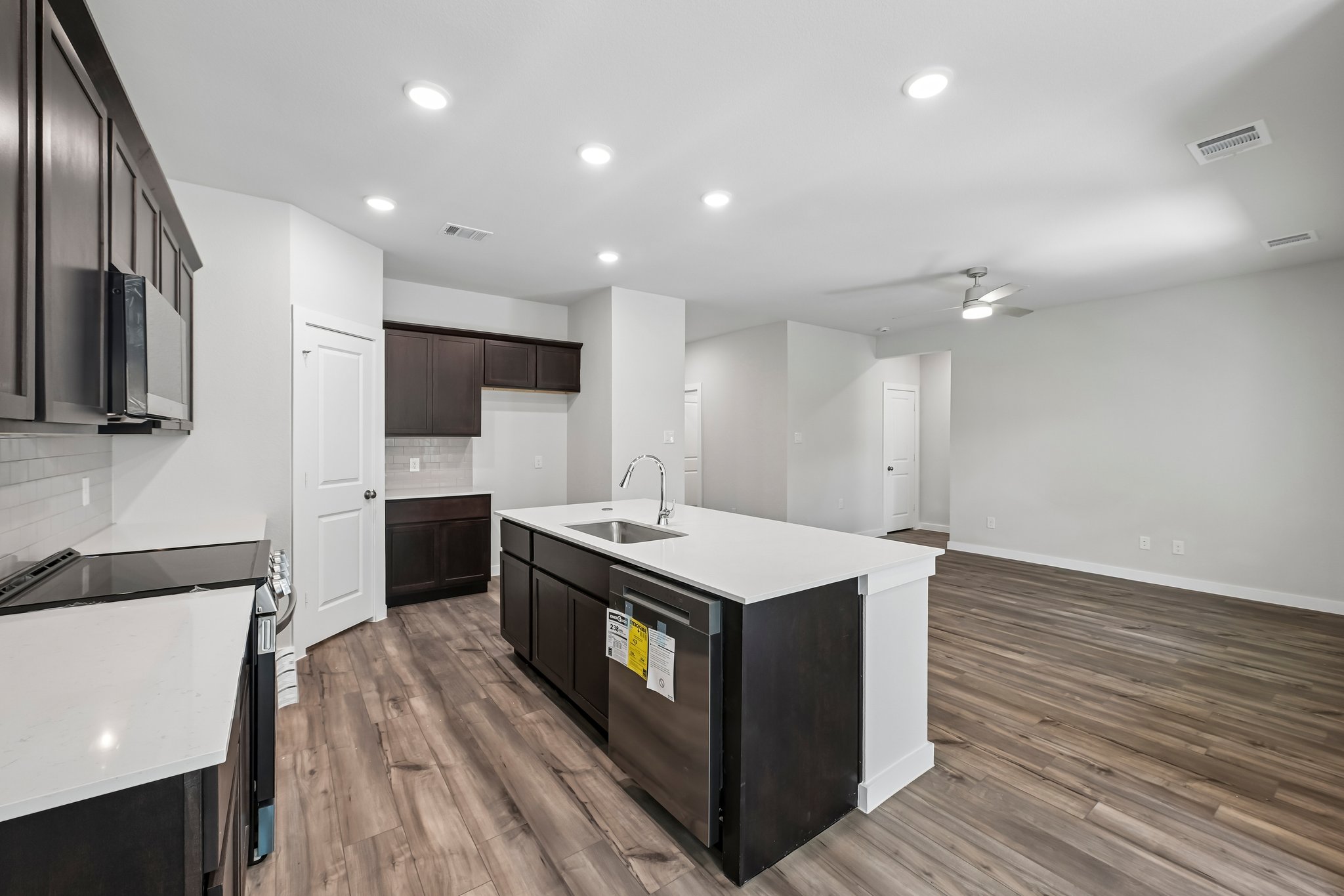 A kitchen with wooden floors.