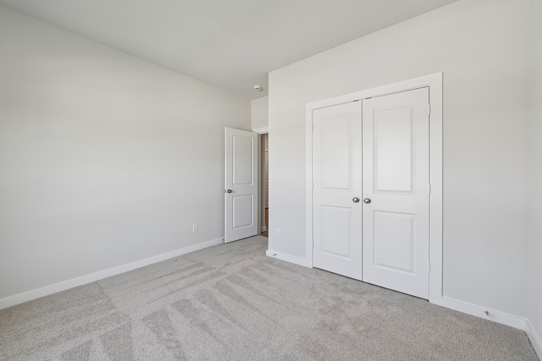 A room with white doors.