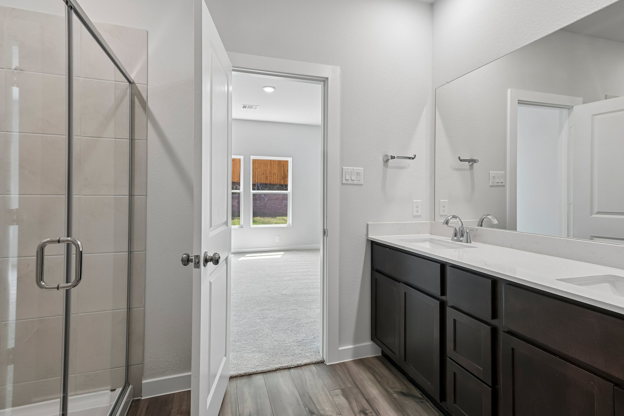 A bathroom with a glass shower.
