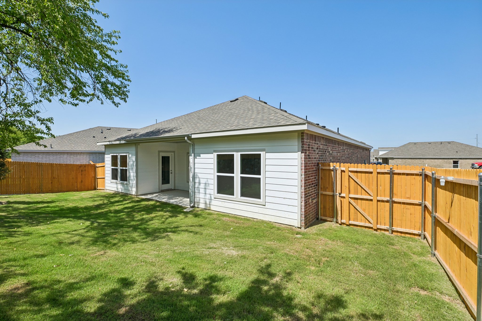 A small house with a fence.