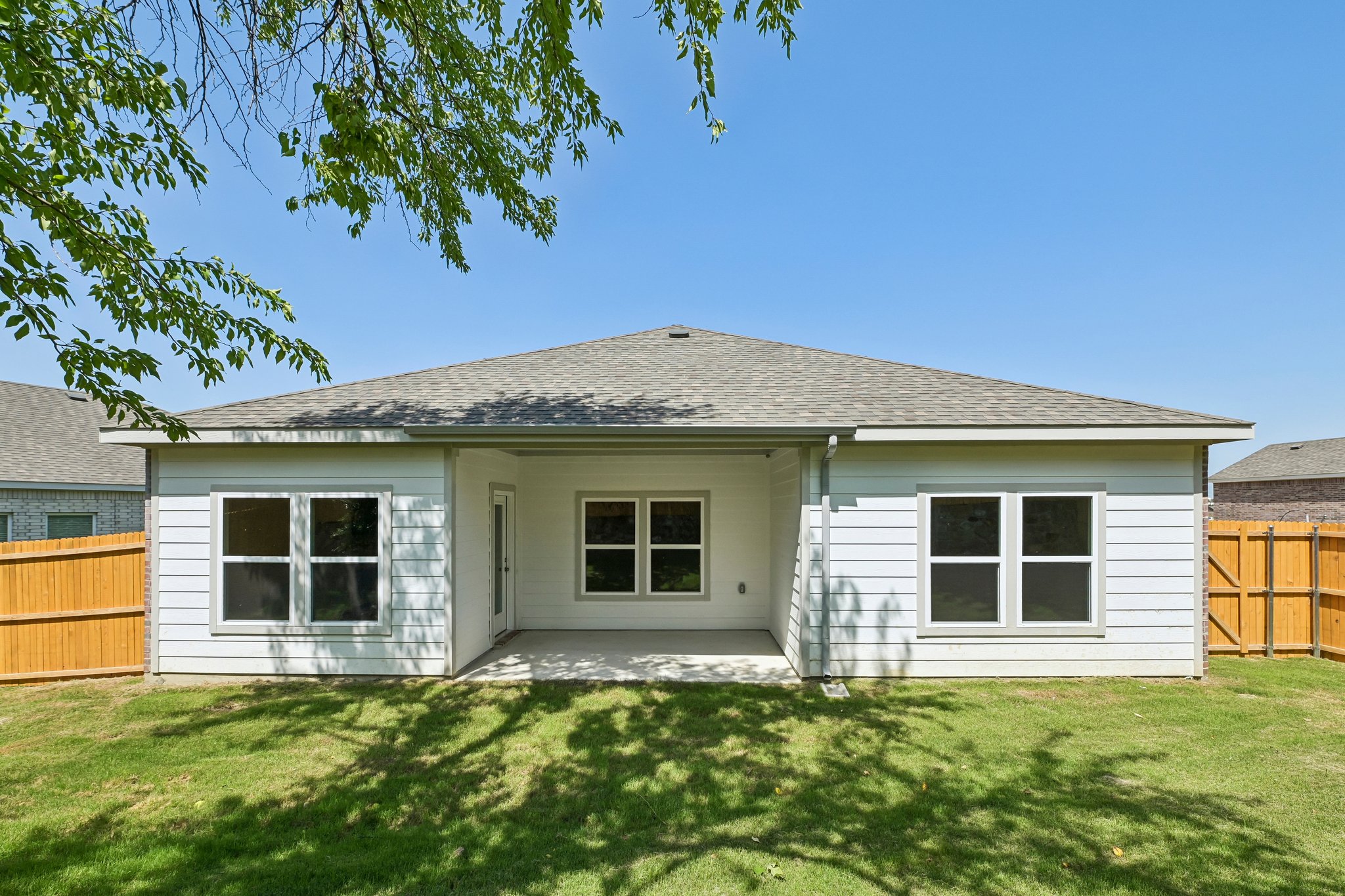 A house with a grass yard.