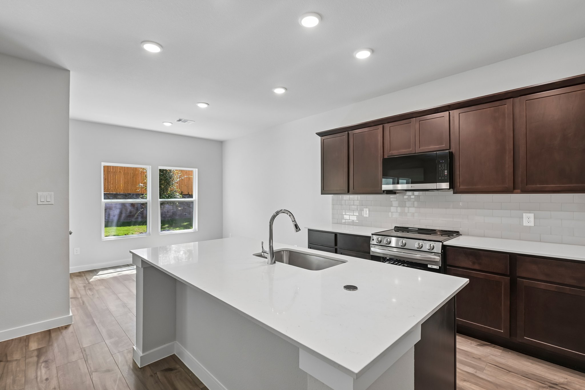 A kitchen with a white counter top.