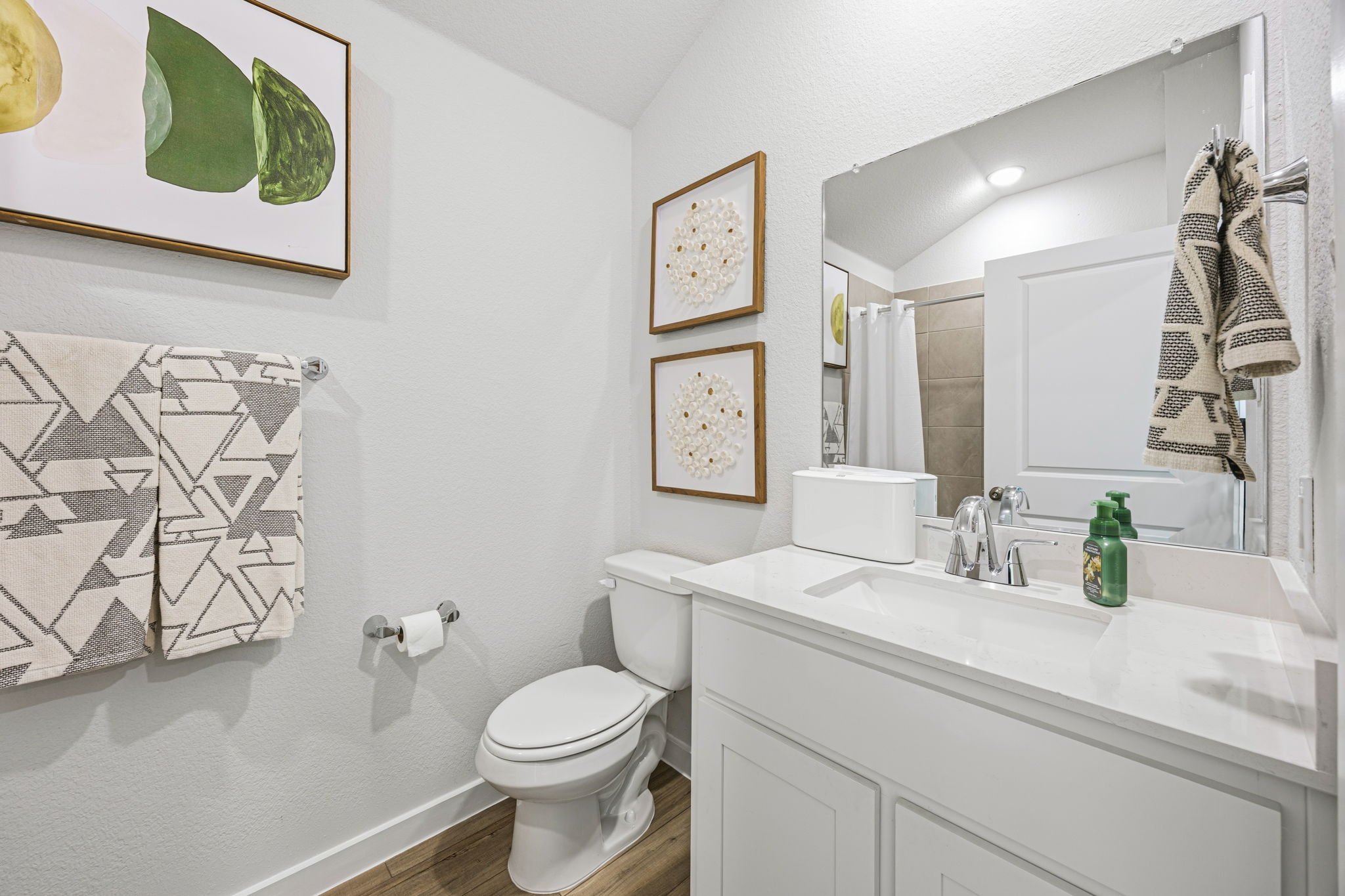A bathroom with a toilet and a sink.