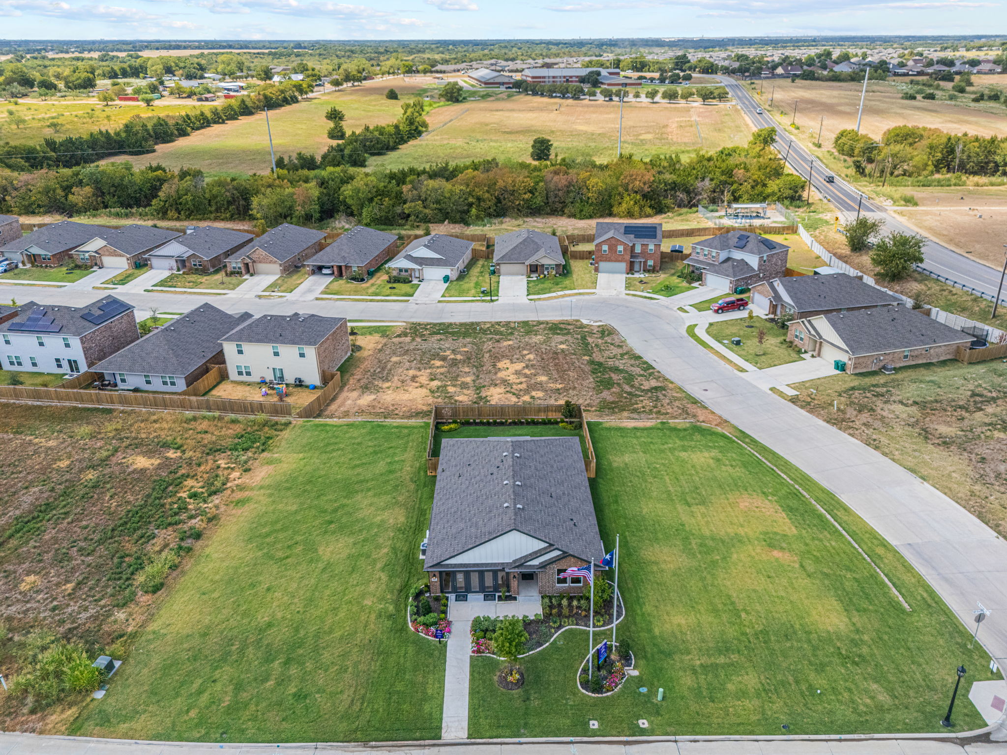 A group of houses in a field.