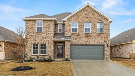 A brick building with a garage.