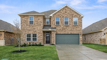 A brick building with a driveway.