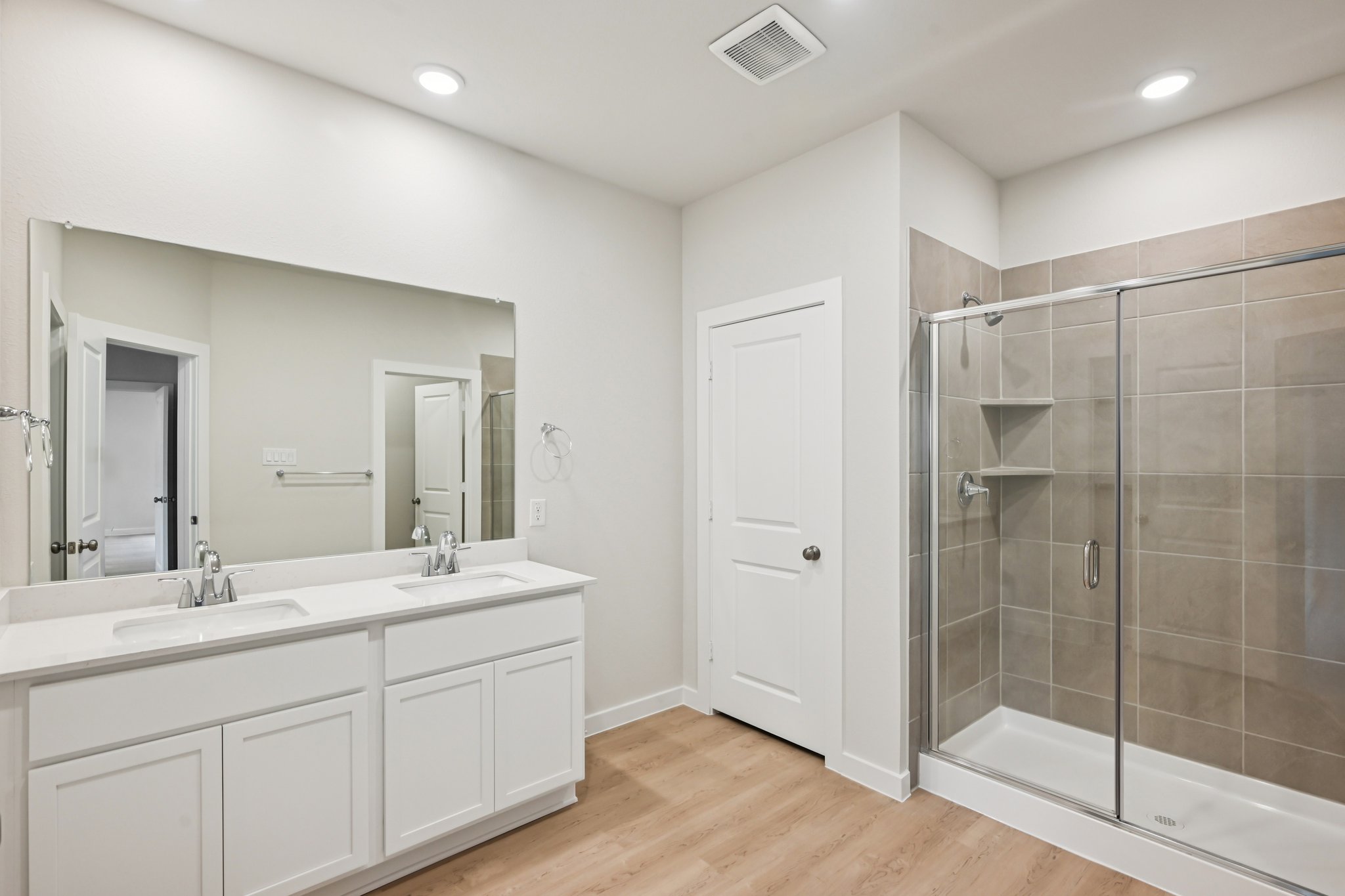 A bathroom with a glass shower.