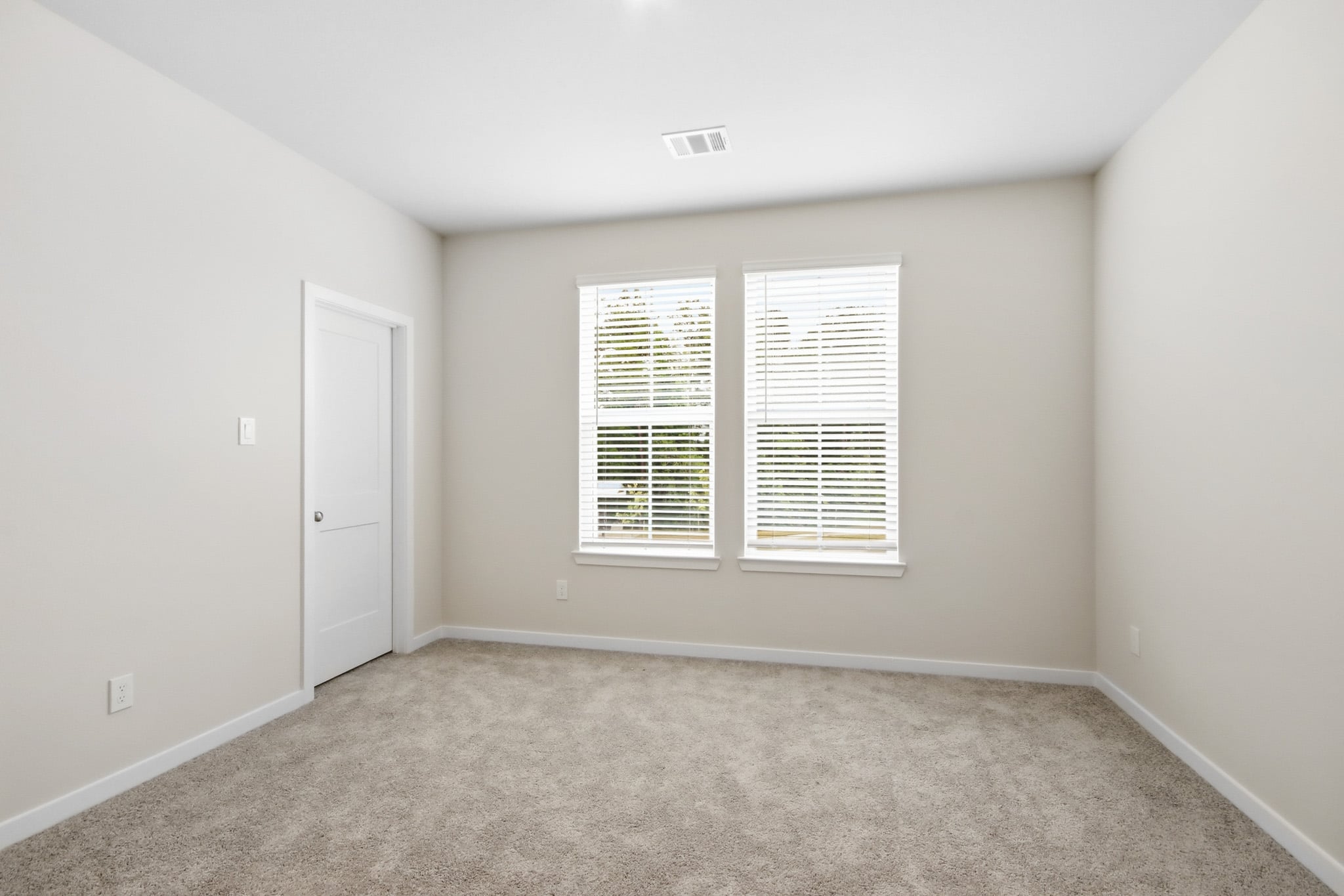A room with a door and a window.