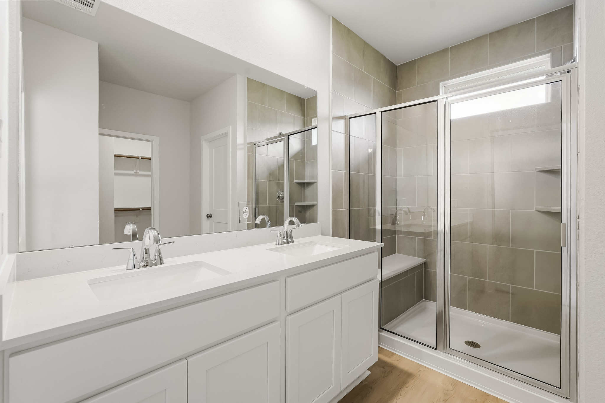 A bathroom with a glass shower.