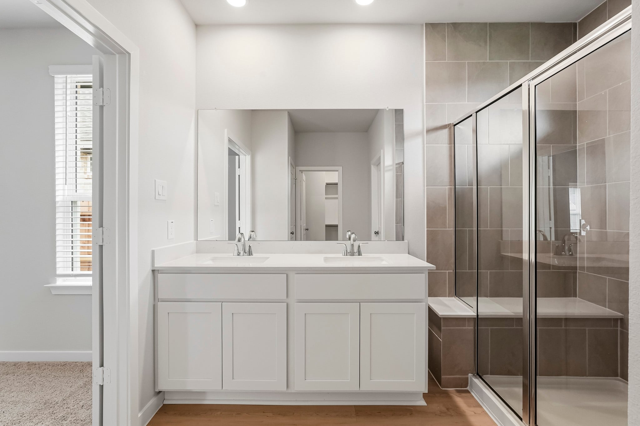 A bathroom with a glass shower.