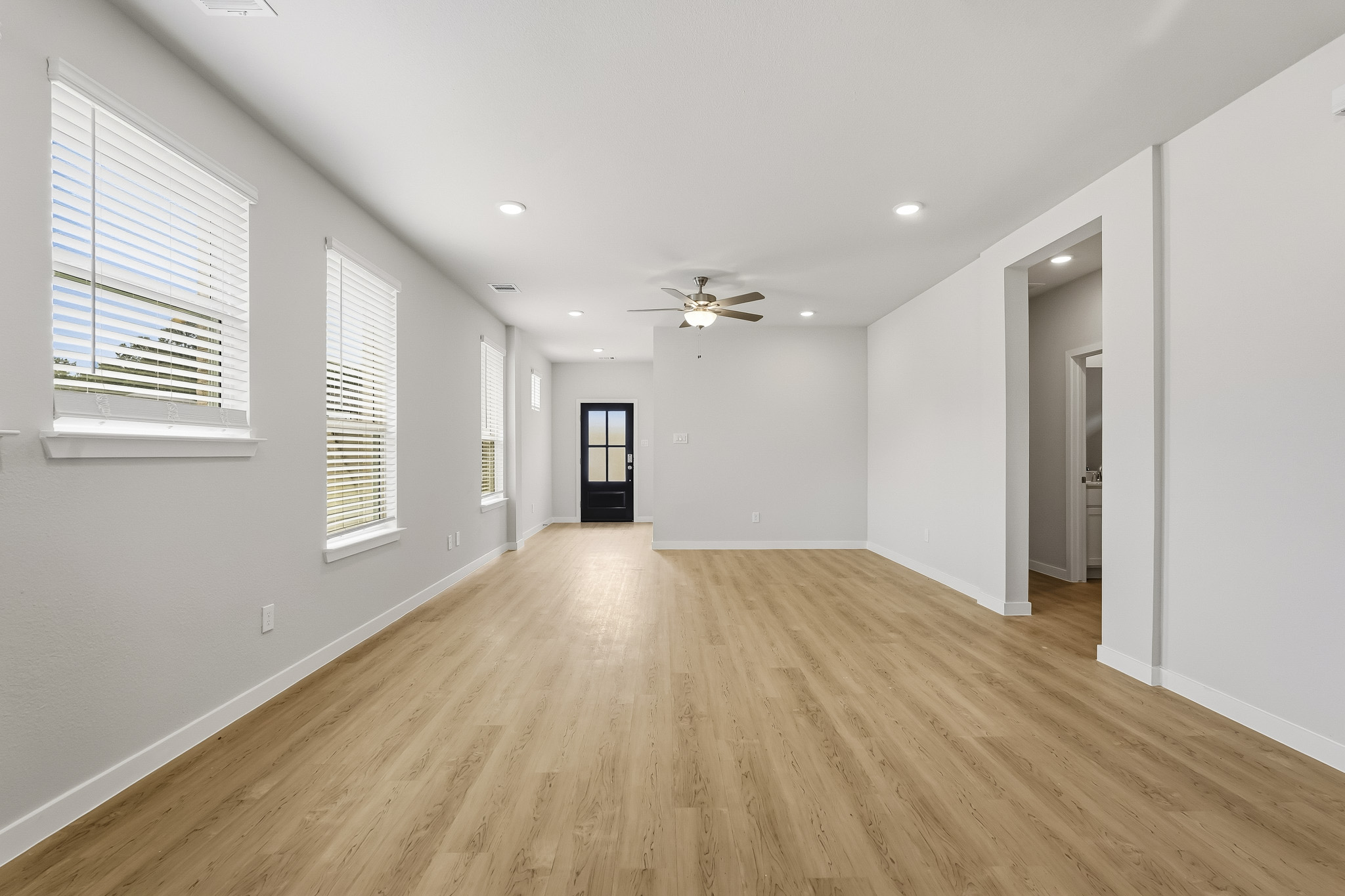 A room with a wood floor and a wood floor.