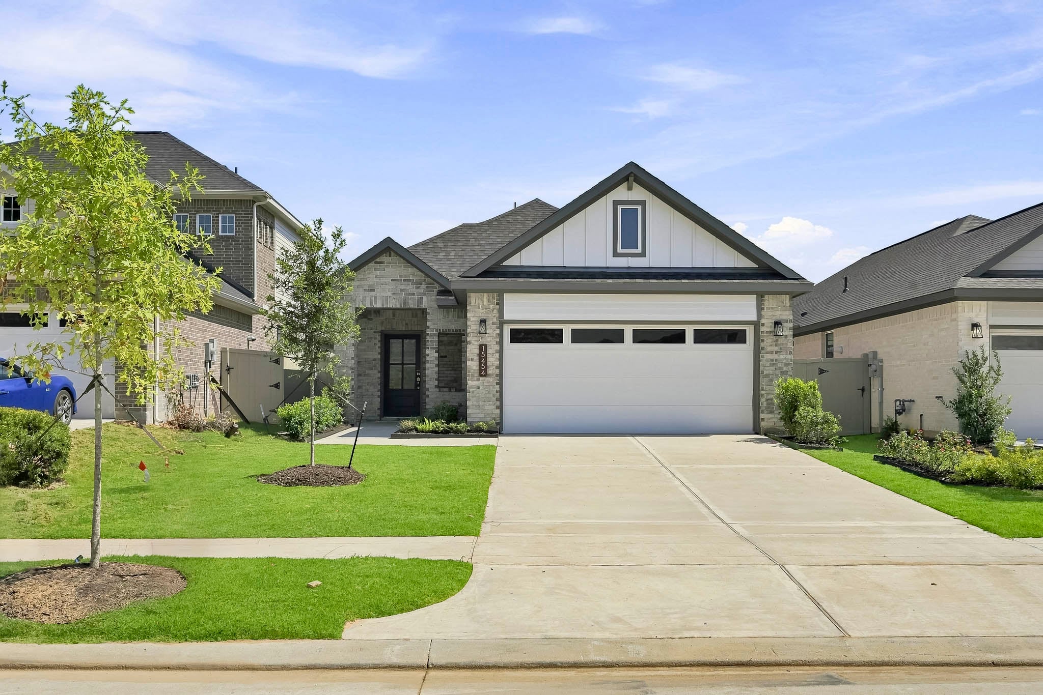 A driveway leading to a house.
