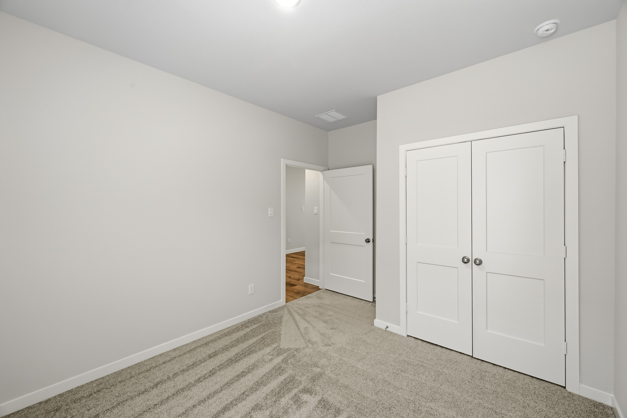A room with white doors.