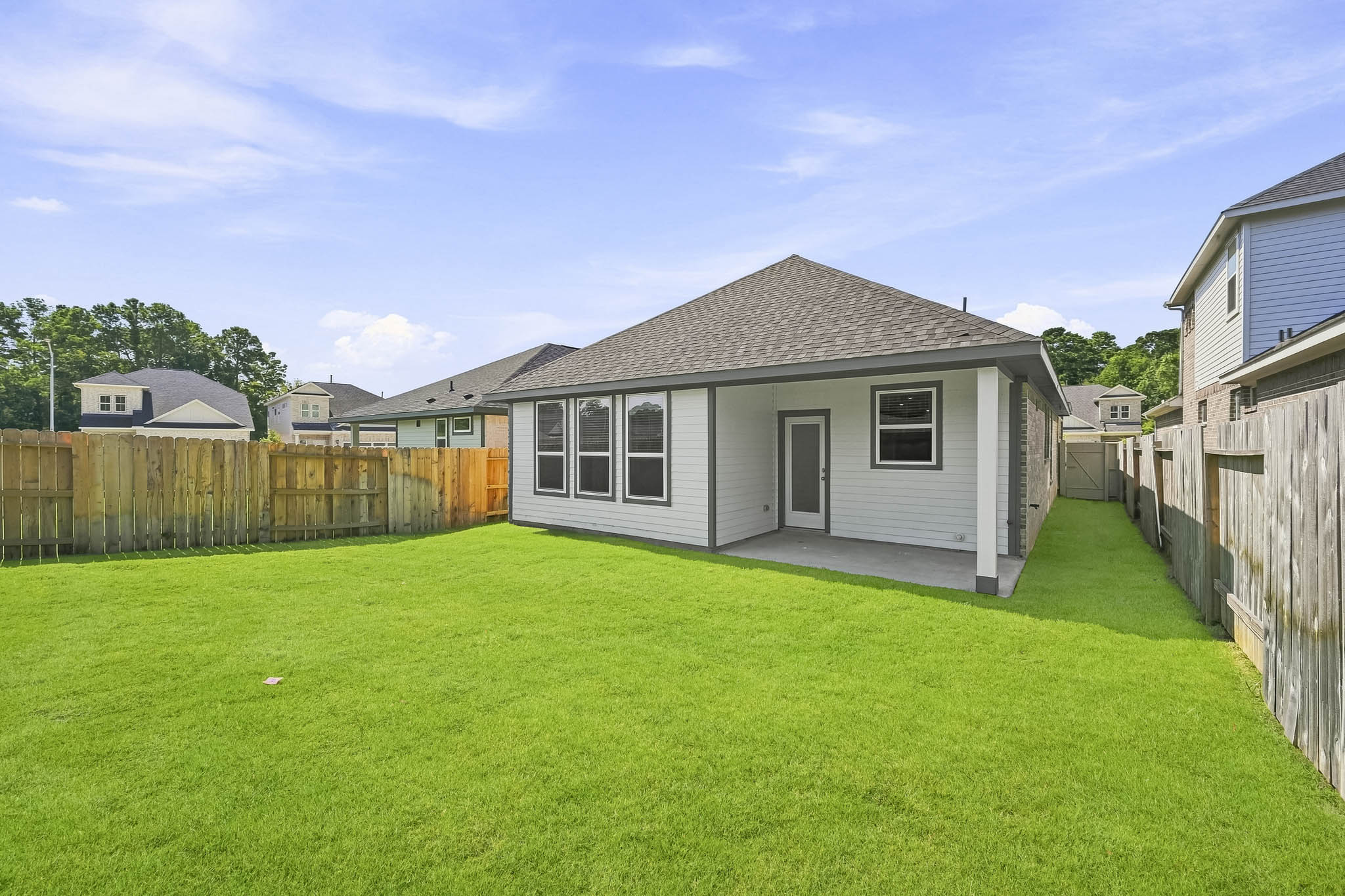 A small house with a fence.