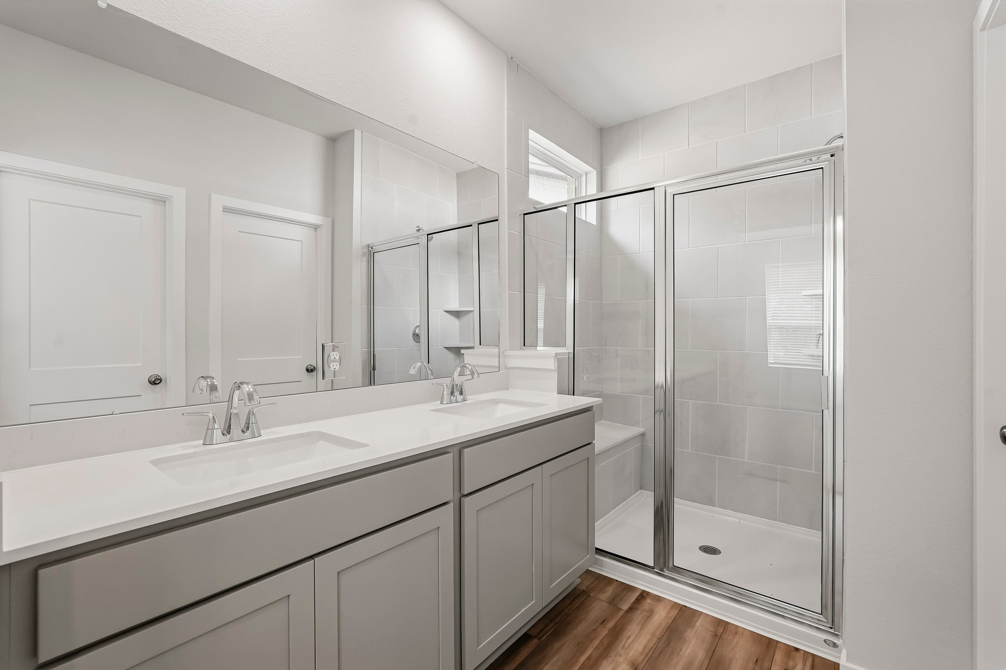 A bathroom with a glass shower.