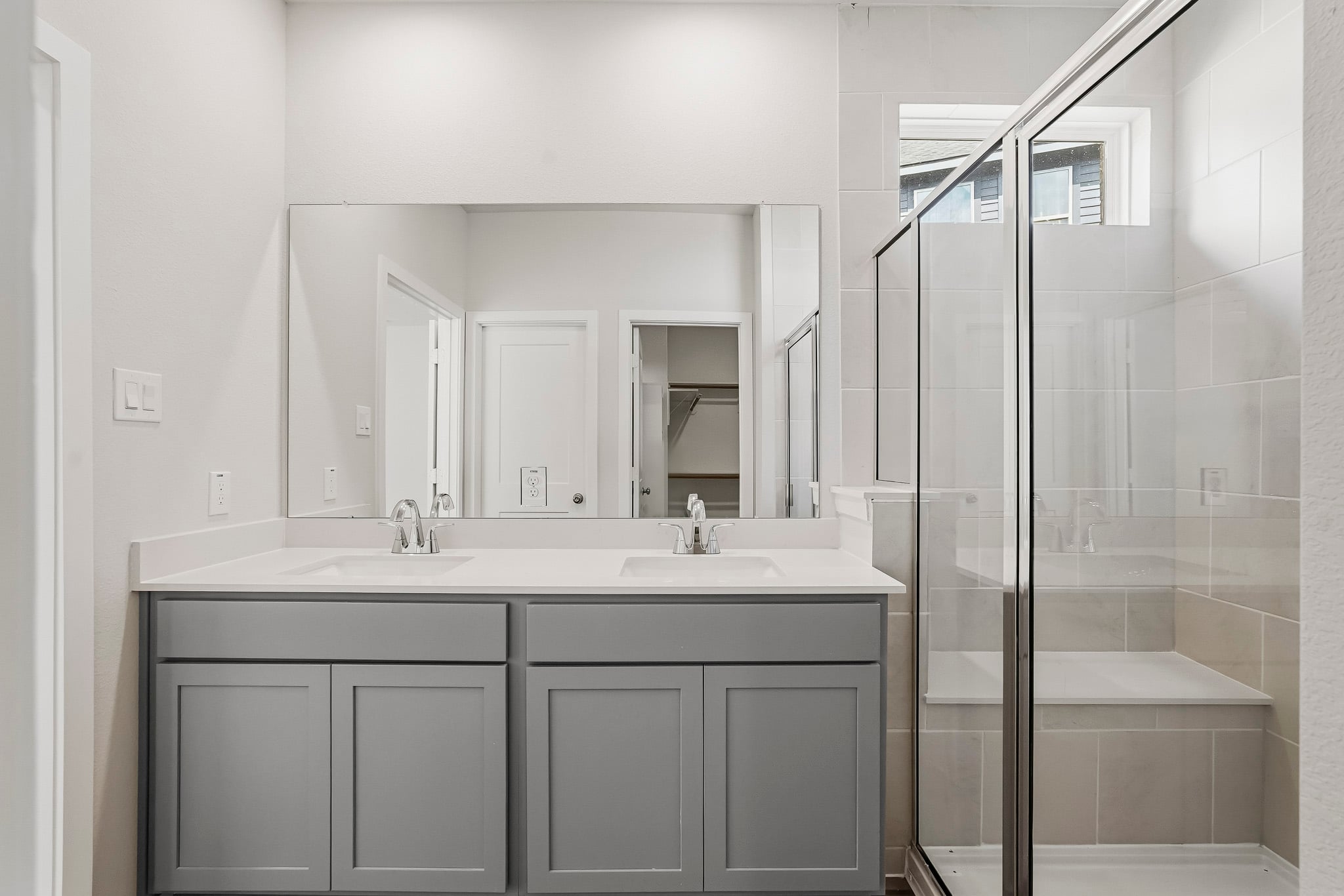 A bathroom with a glass shower.