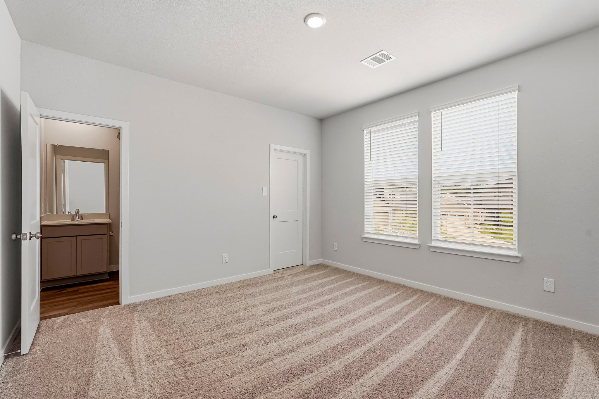 A room with a door and a window.