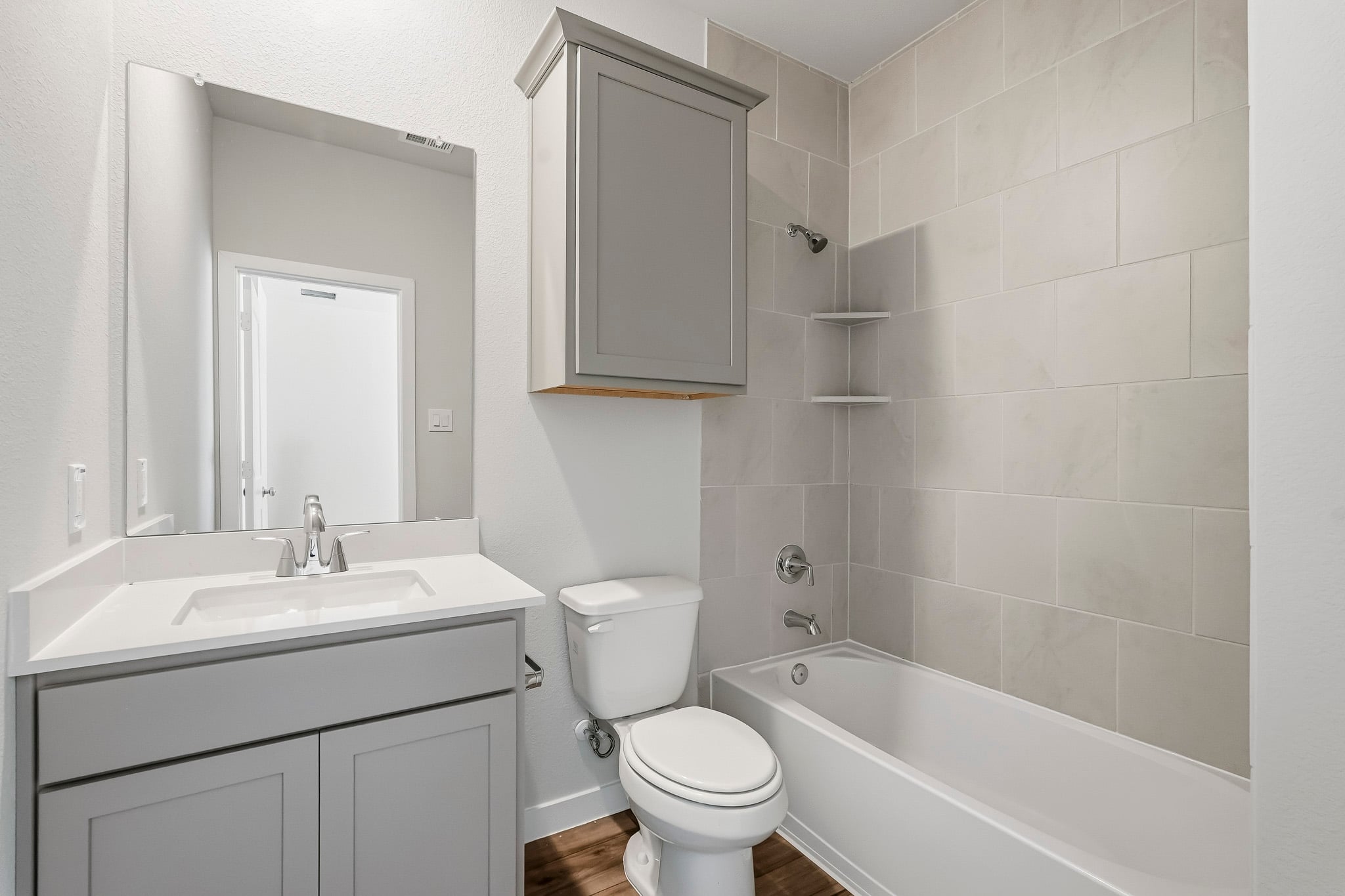 A bathroom with a toilet and sink.