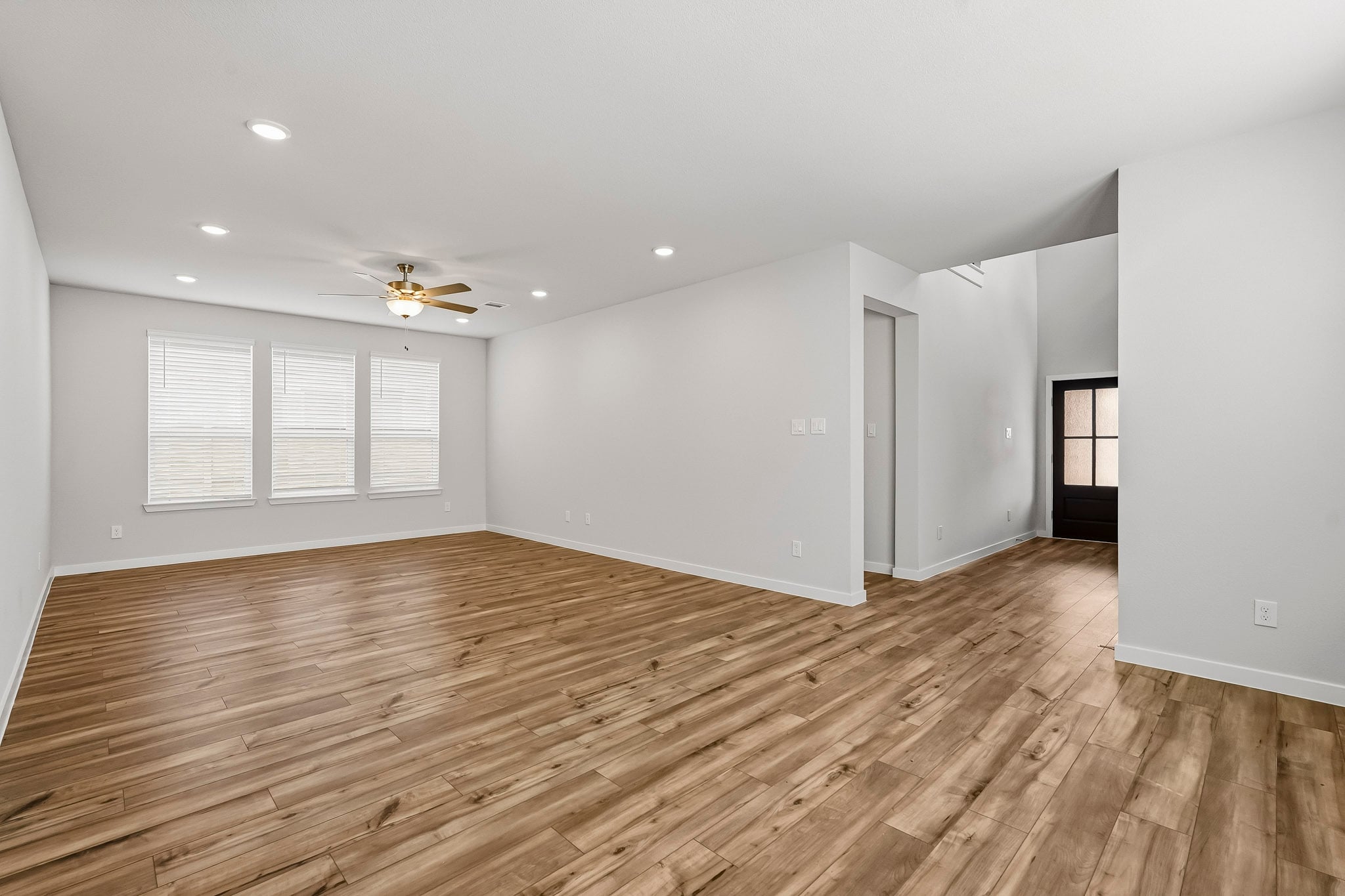 A room with a wood floor and a wood floor.