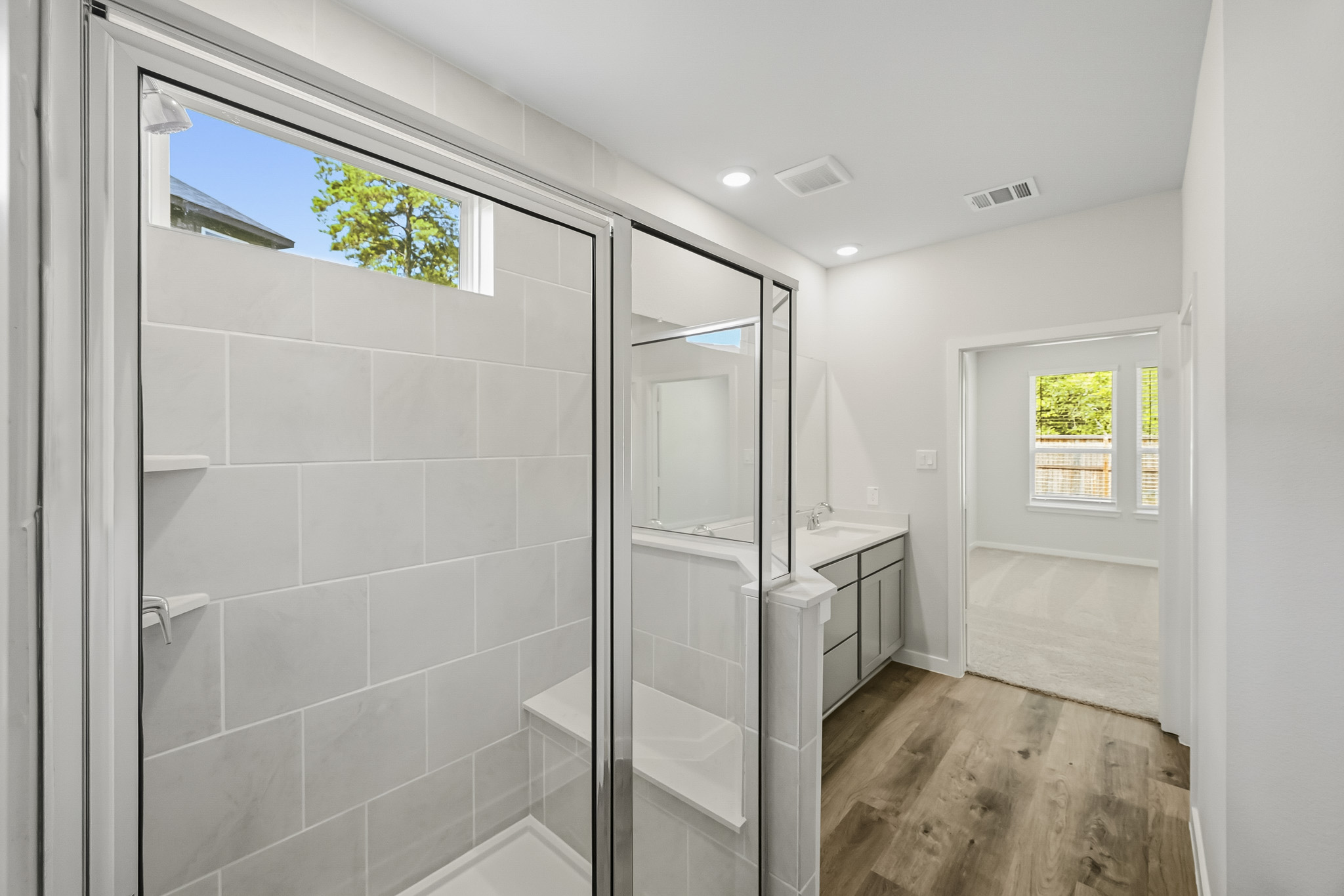 A bathroom with a glass shower.
