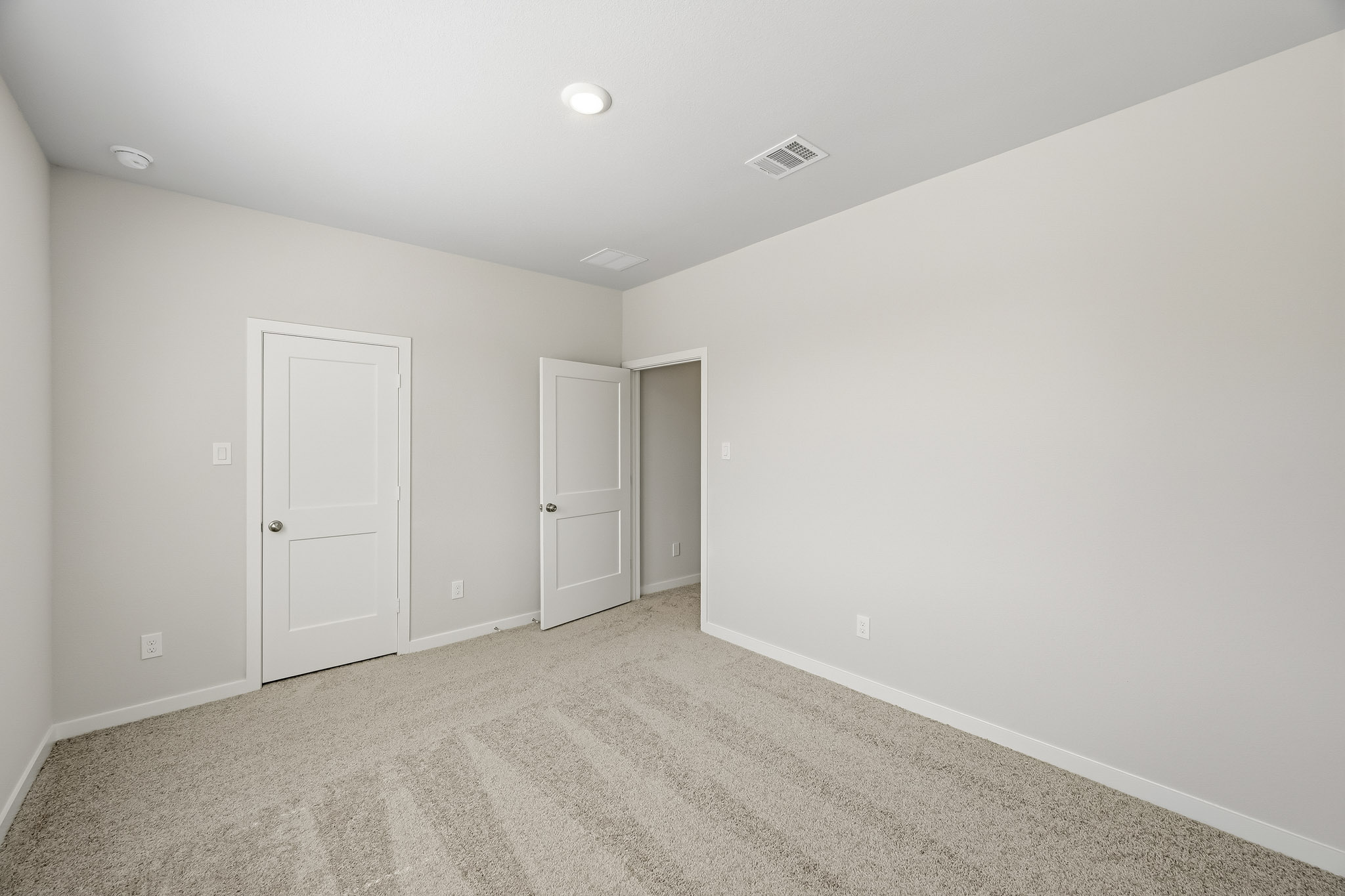A room with white doors.