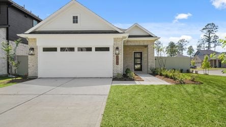 A white house with a driveway.
