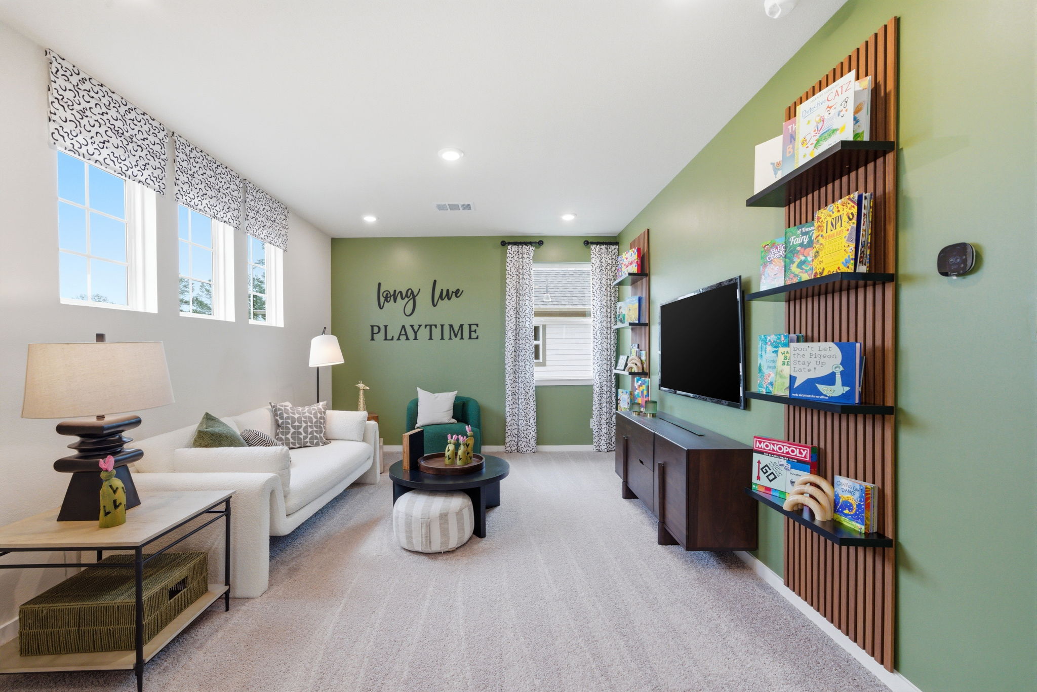 A room with a couch and shelves.